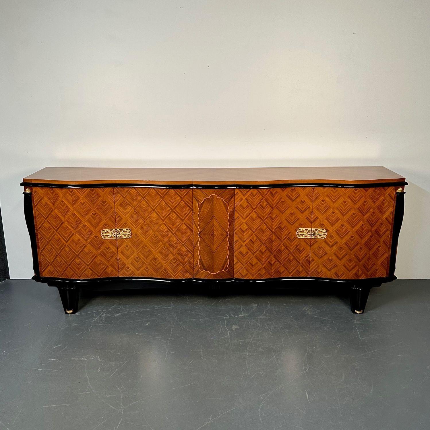 French Art Deco Marquetry Sideboard, Buffet, Rosewood, Walnut, Marquetry, Palatial
 
A stunning monumental sideboard in the Art Deco taste. The satinwood marquetry front having four doors leading to a finished polished shelved and drawer interior.