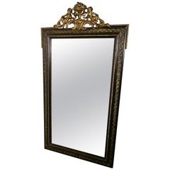 Large French Ebonised and Gilt Wall Mirror, Reclining Cherubs Crest