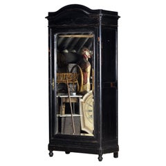 Large French ebonised mirror cabinet, circa 1850