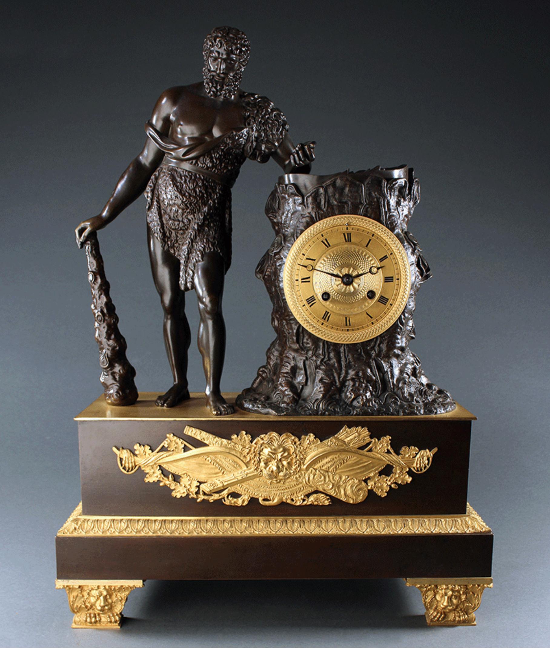 Classic early 19th century French Empire ormolu gilt and patinated bronze mantel clock depicting one of the twelve labours of Hercules/Herakles, stealing the apple of Hesperides. Beautifully cast and chased this large size clock is surmounted by a