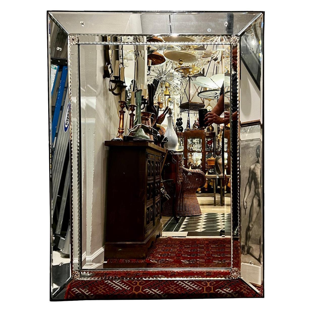 A circa 1950's French etched mirror with beveled frame.

Measurements:
Height: 48.5