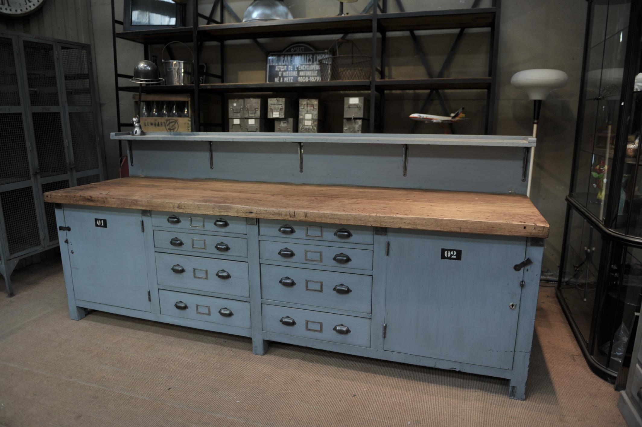 Rare large pine French factory workbench buffet cabinet circa 1930 , eight drawers with metal handles and tag holders, two door with one shelf compartments, recent grey patina, height of main top is 85 cm (waxed finish).sold with jielde light