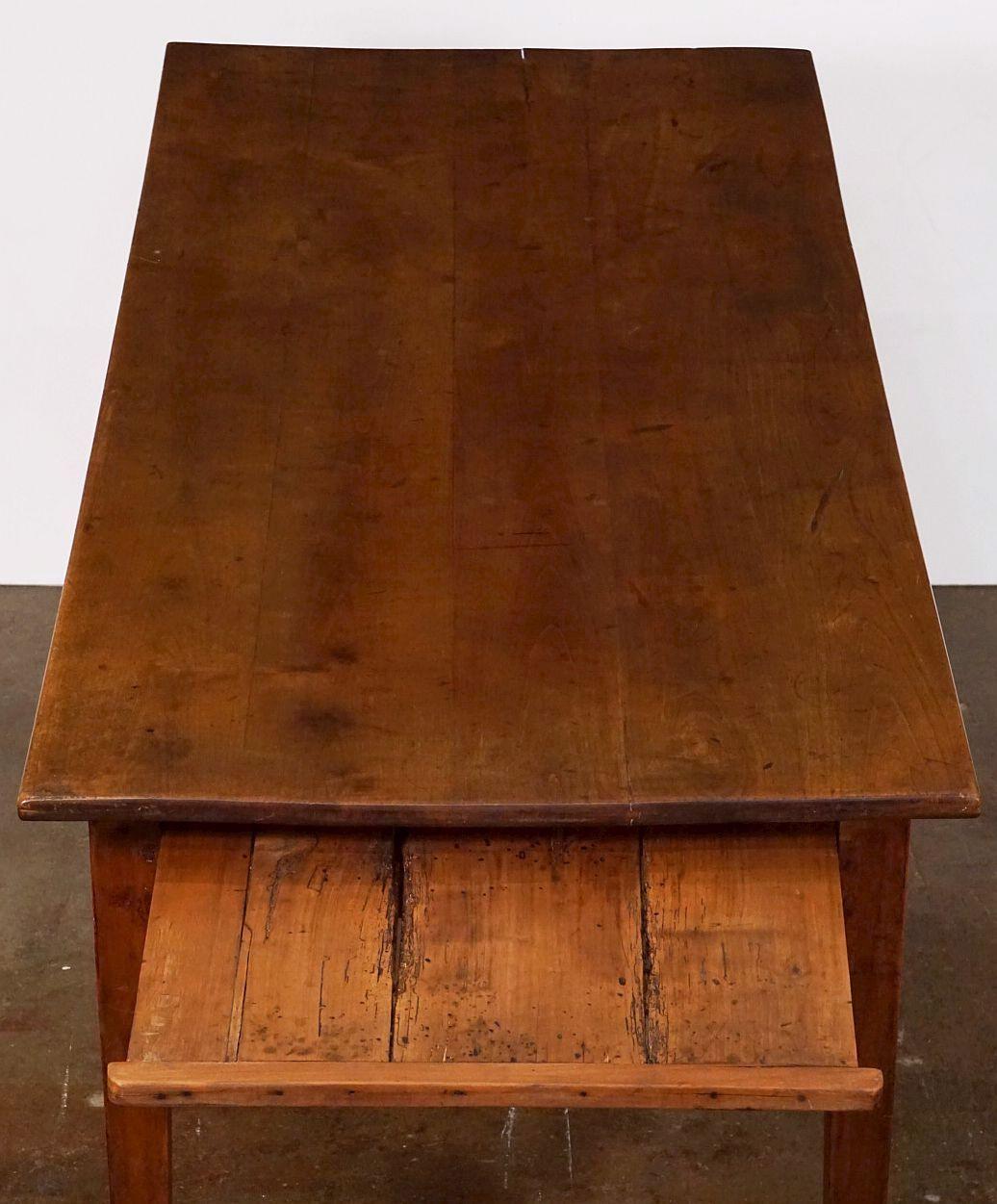 Patinated Large French Farm Table of Cherry with Drawer and Pull-Out Bread Board For Sale