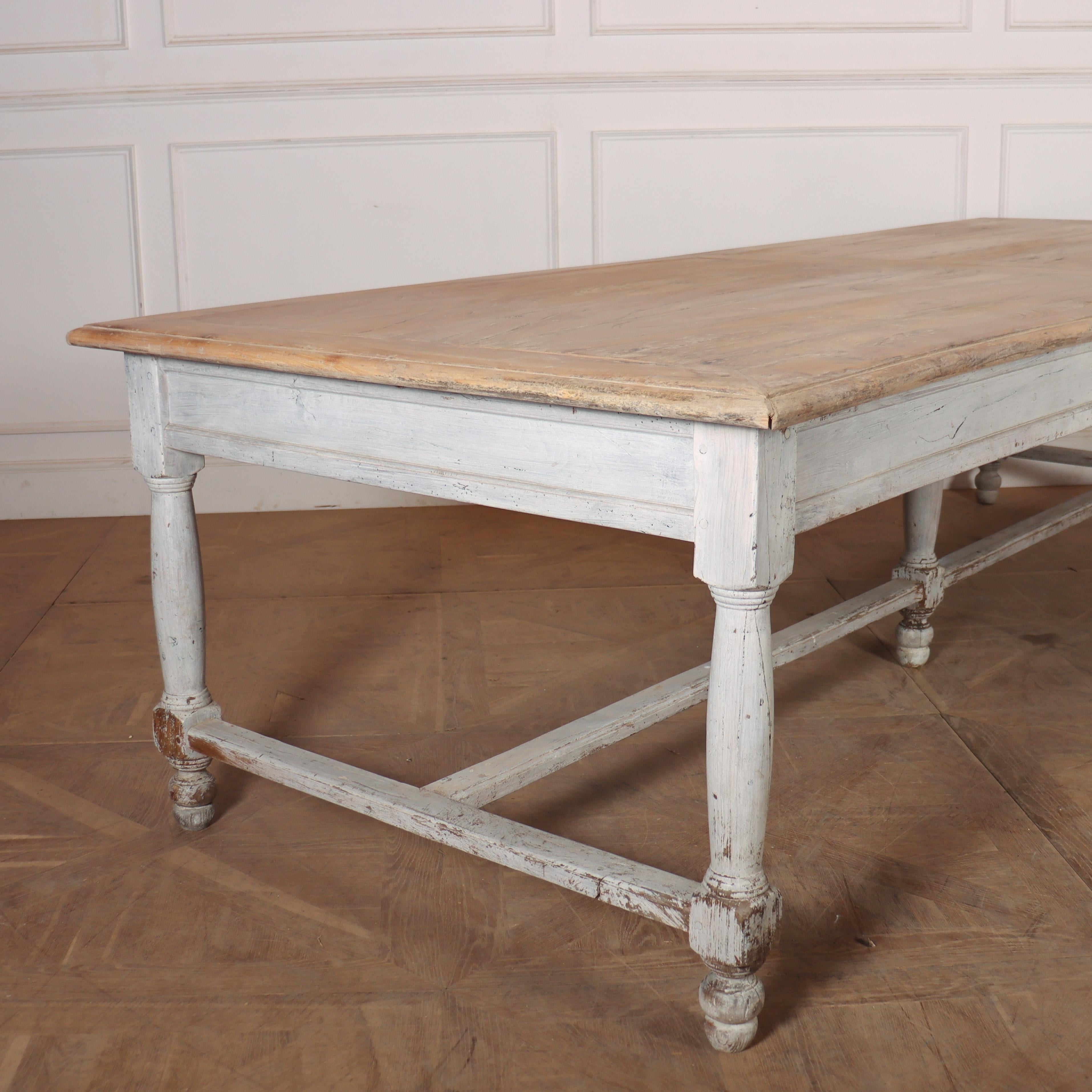Wonderful early 19th C French farmhouse table with an original painted base and a scrubbed and bleached elm panelled top. 1810.

Clearance is 24.5