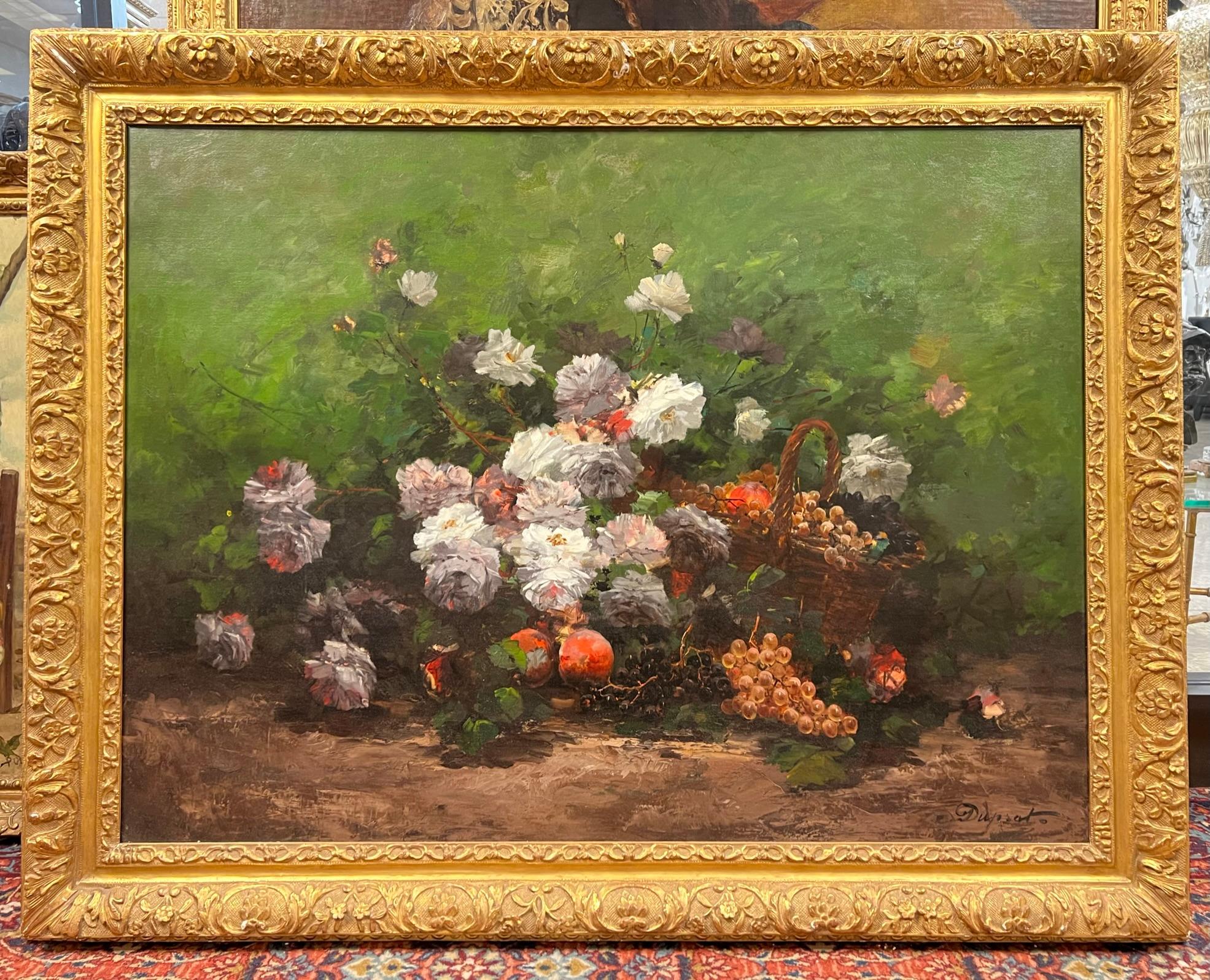 Our beautiful and large still life on canvas depicts harvested grapes and peaches spilling from a woven rattan basket, surrounded by peach tree blossoms in full bloom. Signed Duprat or possibly Duprato. Stretcher approximately 38 by 51 and giltwood