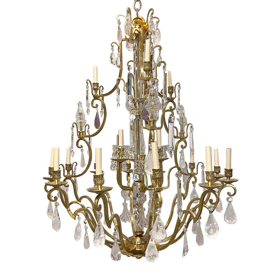 A French circa 1920s gilt bronze chandelier with gilt bronze finish and original patina rock crystal and amethyst pendants.

Measurements:
Diameter 45