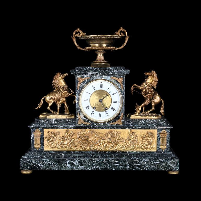 19th Century gilt bronze-mounted and green marble mantel clock Set, the dial and movement by: Balthazar à Paris, late 19th century dial with white enamel Roman numerals. This piece is absolutely striking  with gilt bronze sculptures flanking the