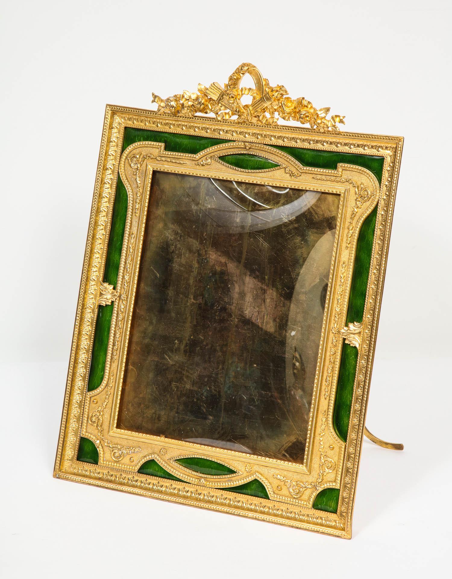 A beautiful and large French gilt bronze ormolu and green Guilloche enamel antique picture photo frame, circa 1895.

Very fine quality. Marked France to the back.

Frame size: 15