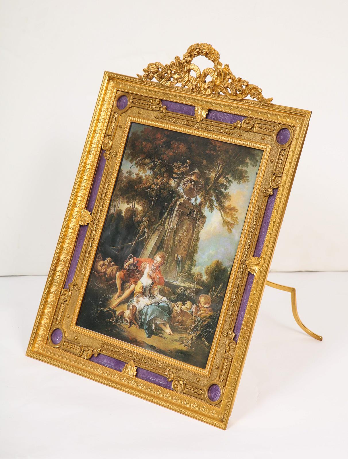 A beautiful, large, and elegant French gilt bronze ormolu and purple Guilloche enamel antique picture photo frame, circa 1895.

Very Fine quality. Marked France to the back.

Frame size: 15