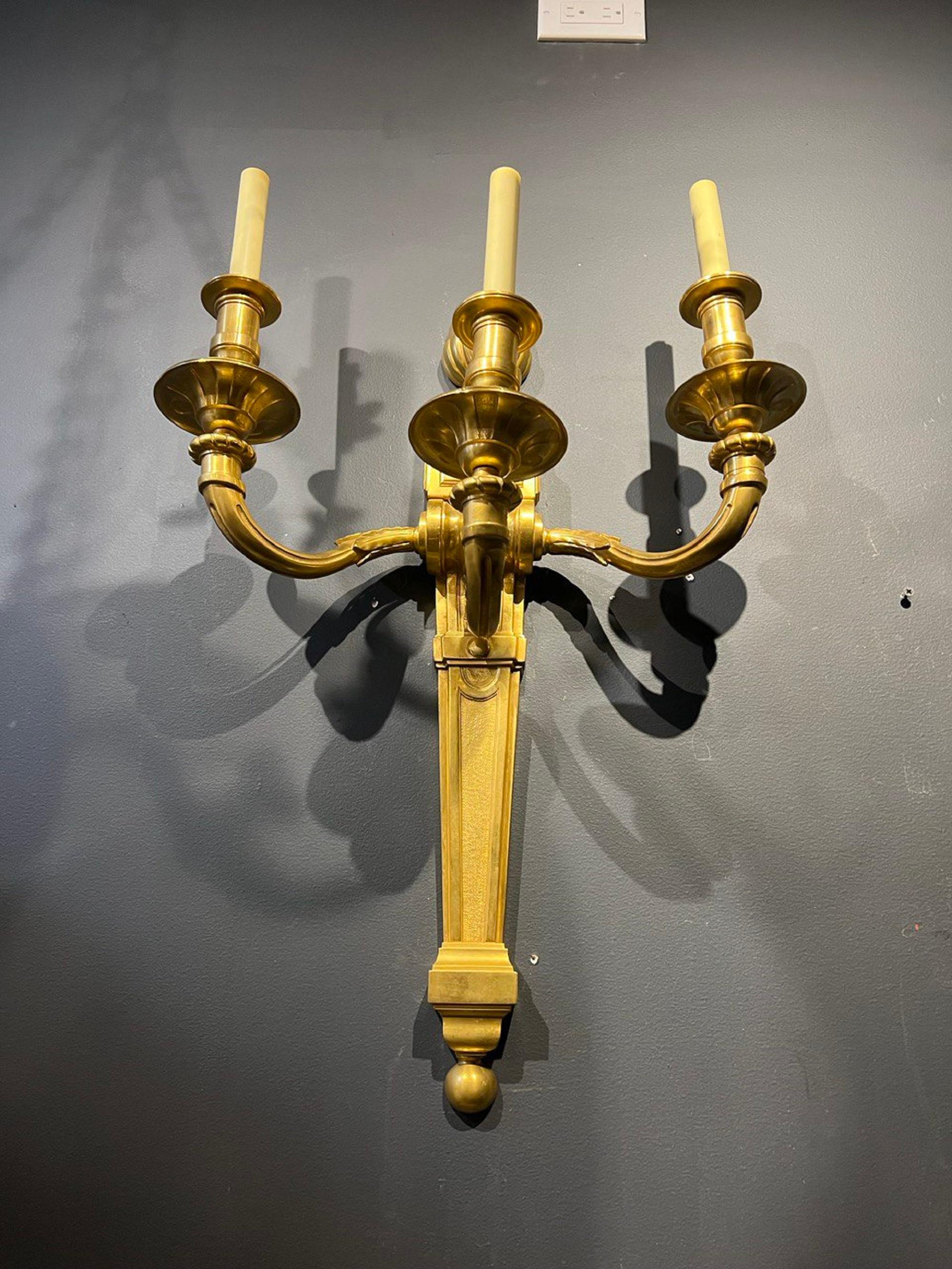 A pair of circa 1940’s gilt bronze French sconces with 3 lights in an unusually large size.

Dealer: G302YP