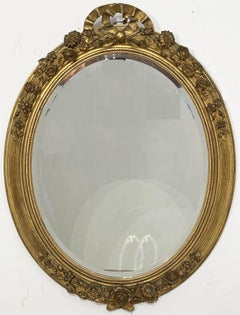 Large French Gilt Oval Beveled Wall Mirror with Ribbon Tied Crest and Frieze