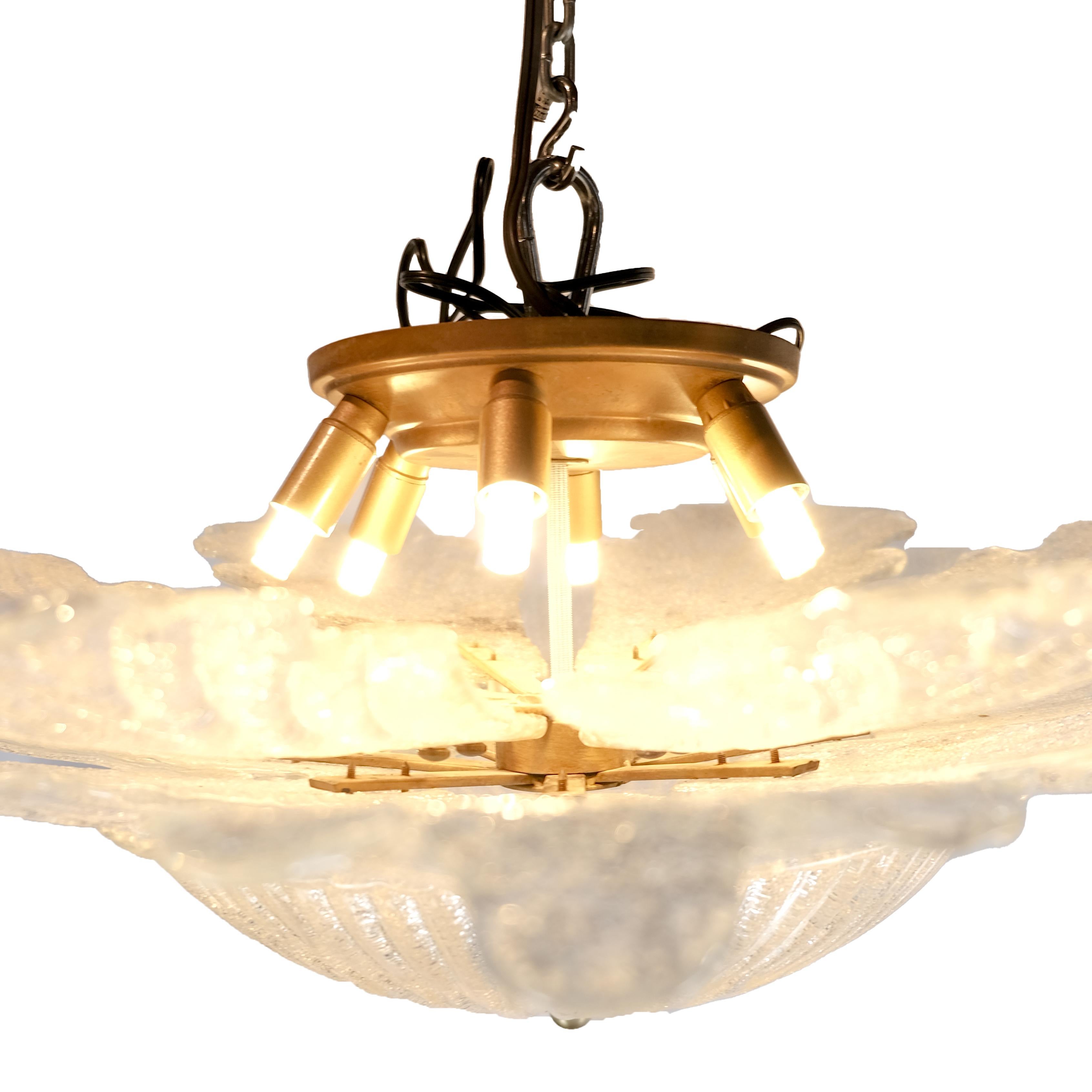 Large statement piece. Mid-Century Modern all glass, large multi leaf, fluted bowl base French chandelier. Glass has a stunning crystalized appearance. Hardwired.
Six LED small lights in small sockets.
