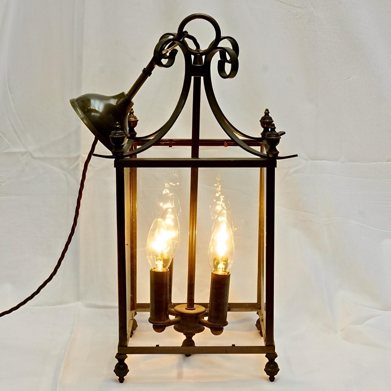 Large glazed four light French lantern in a stylish simple design. The lantern has been rewired for the UK, and pat tested. It has four metres of dark brown twist flex.

This wonderful classic lantern dates to the mid-20th century.
