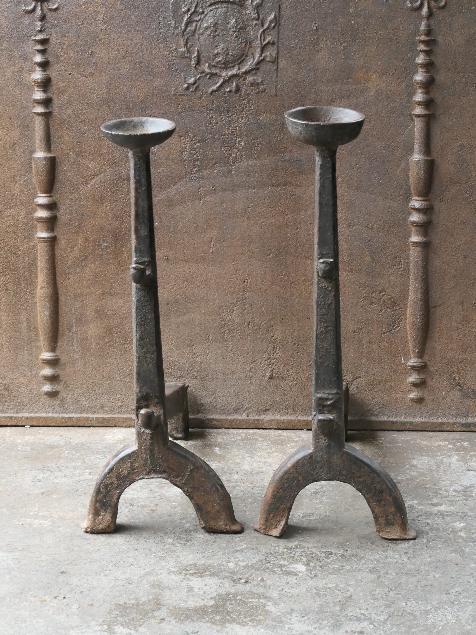 Large 17th century French andirons made of wrought iron. The style of the andirons is gothic. These French andirons are called 'landiers' in France. This dates from the times the andirons were the main cooking equipment in the house. They had spit