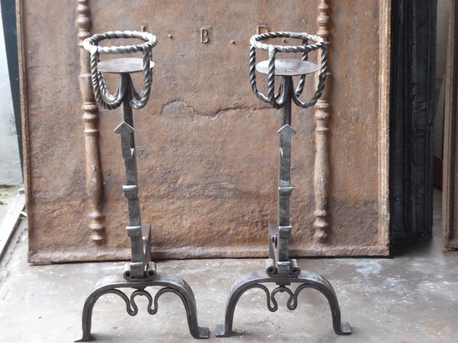 Large 18th century French andirons made of wrought iron. The style of the andirons is Gothic. These French andirons are called 'landiers' in France. This dates from the times the andirons were the main cooking equipment in the house. They had spit