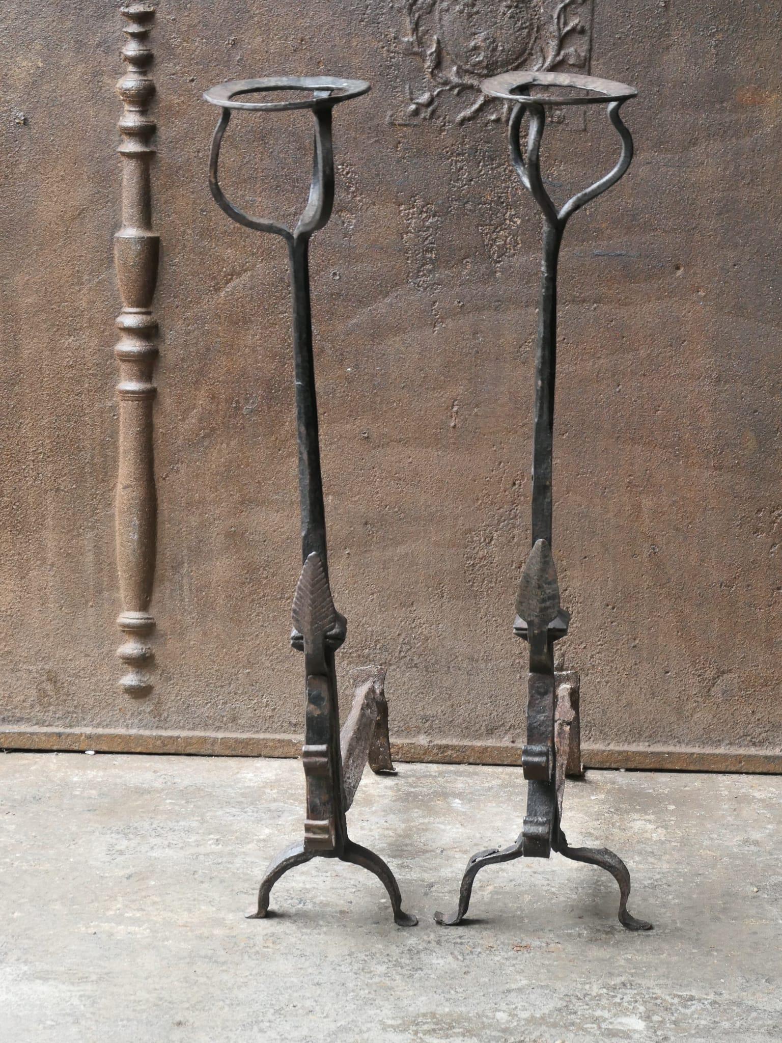 Large early 19th century French Gothic Style Period andirons. The andirons are made of wrought iron. The condition is good.