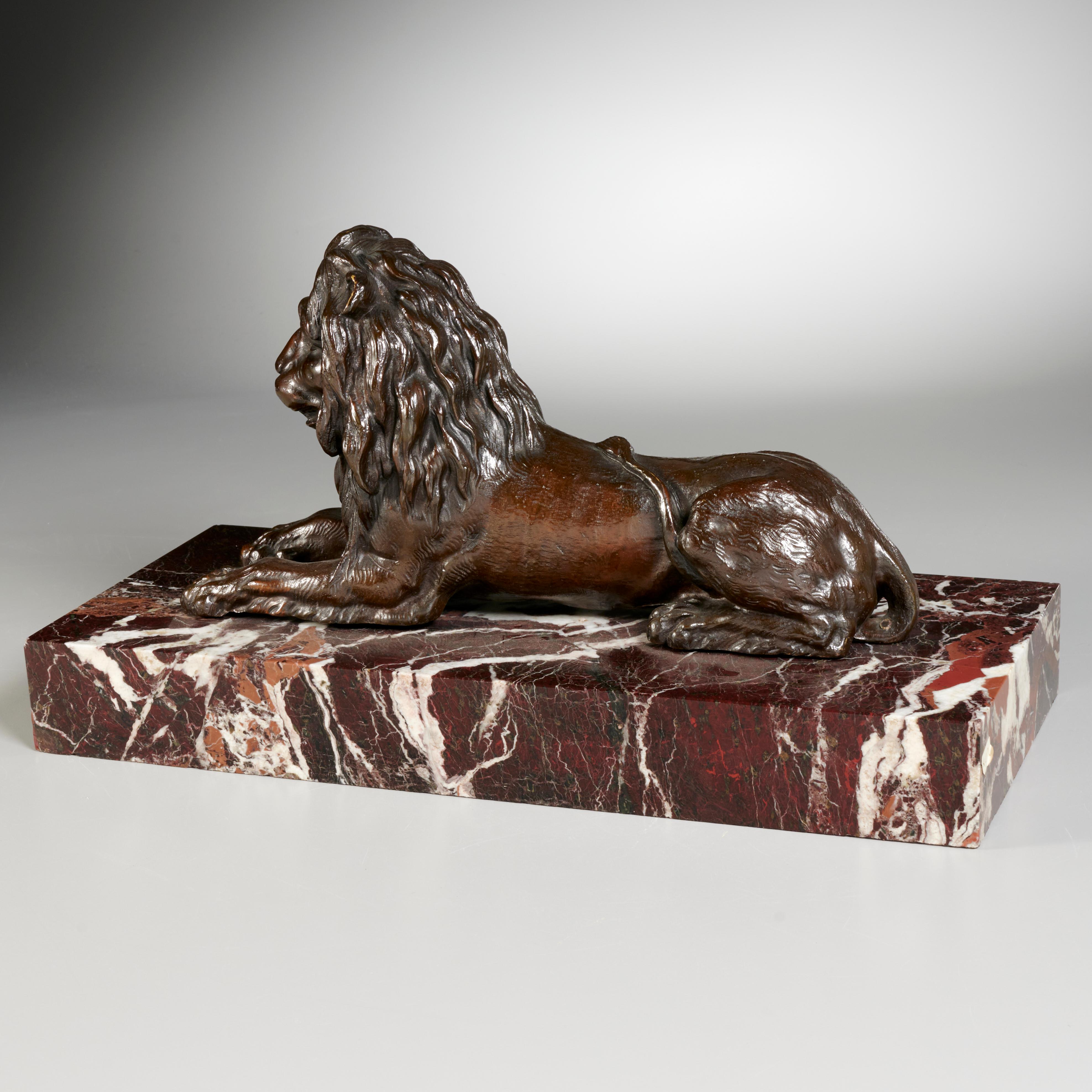 Large French Grand Tour Period Bronze Sculpture Recumbent Lion In Good Condition For Sale In Montreal, QC