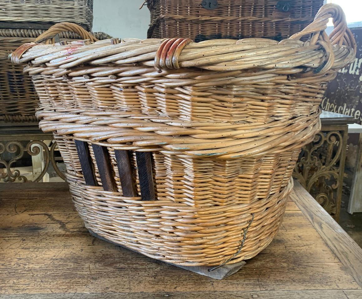 A nice early 20th century grape harvesting basket from the Champagne region of France. These were used to harvest the grapes in the vineyards and still have the painted markings of the vineyard owner. circa 1900.
Please contact us for a shipping