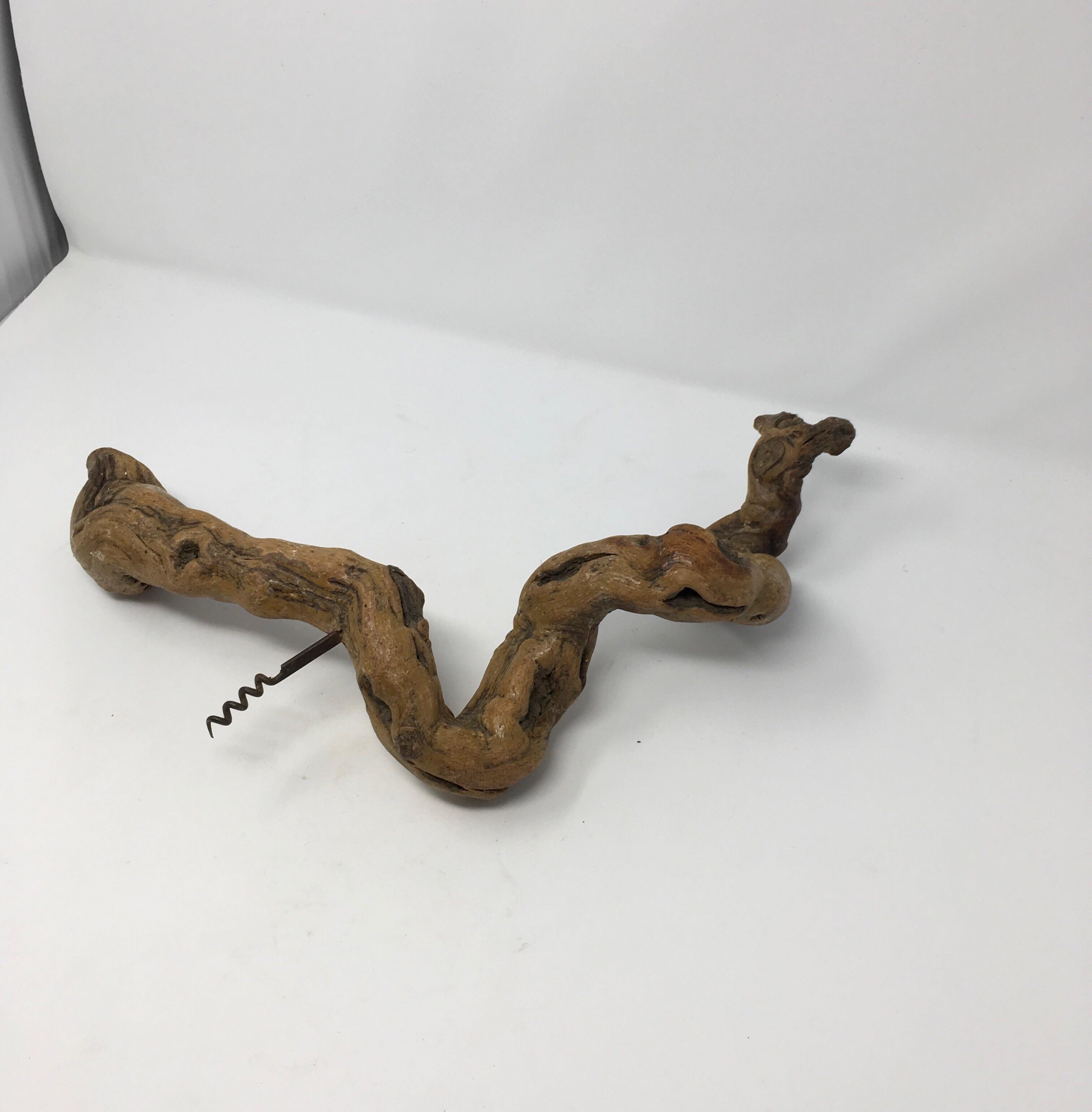 Found in France, this beautiful, large grapevine corkscrew was handmade in the vineyards of Southern France. Perfect to open your wine or hang as a decorative display. A unique piece for the wine lover to add French charm to any wine room, bar or