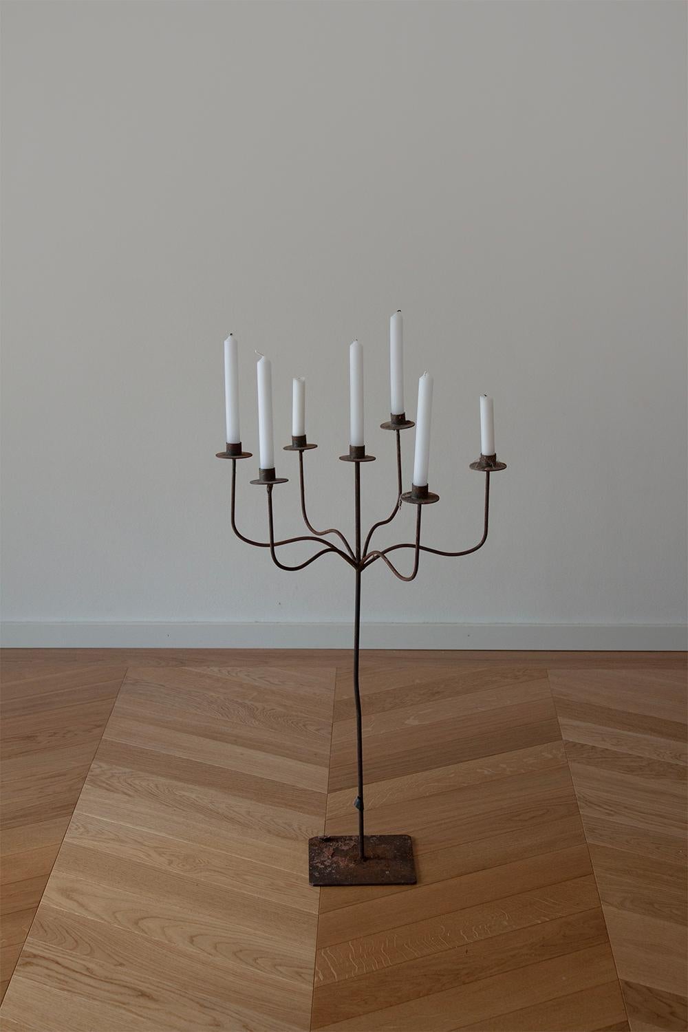 This large French iron candelabra is a magnificent centerpiece that effortlessly infuses any home with a touch of chateau grandeur.
Made from Iron it's been Hand bent and welded. The straight lines and delicate curves are all meticulously