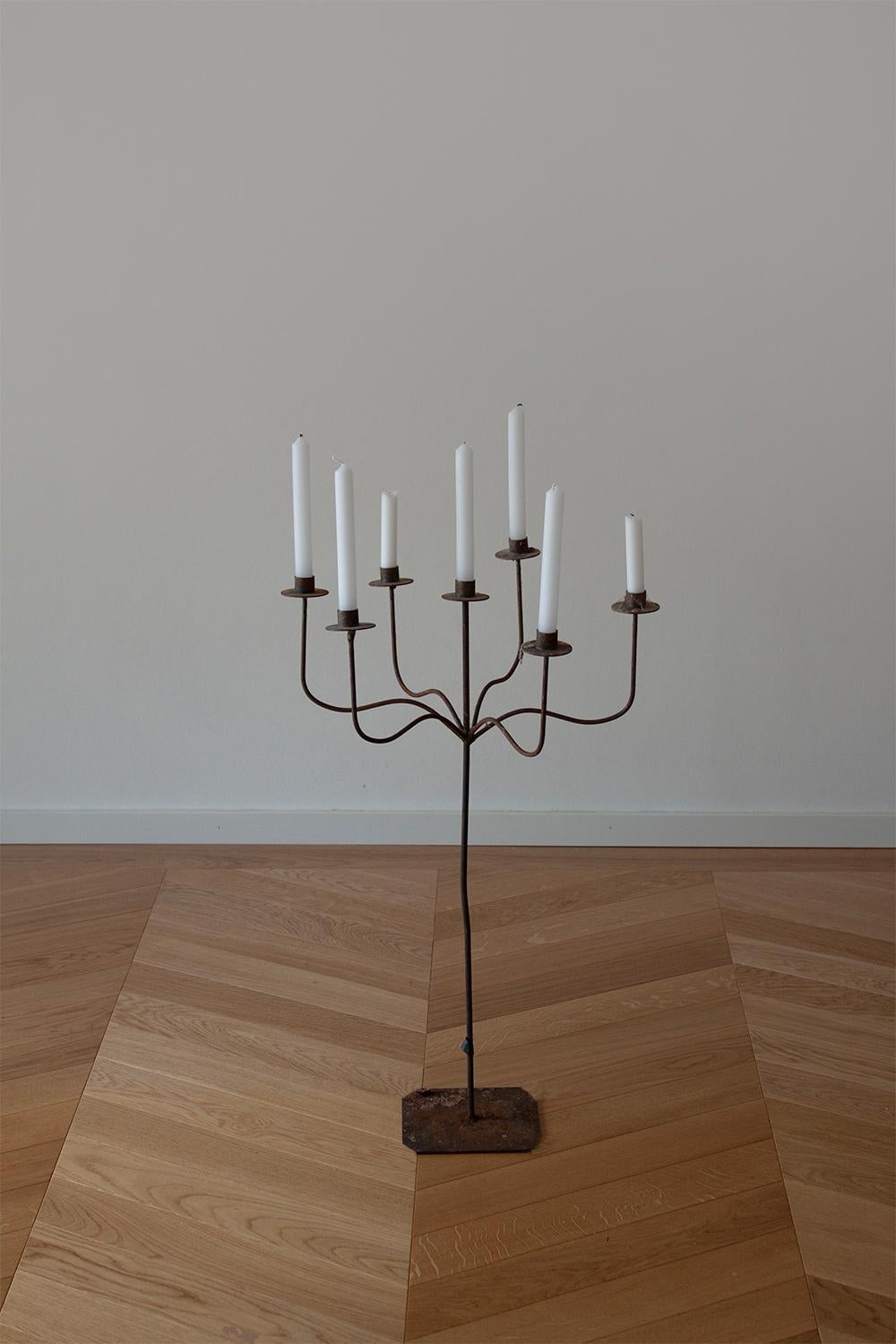 This large French iron candelabra will be a magnificent centerpiece that effortlessly infuses any home with a touch of chateau grandeur.
Made from Iron this candelabra is hand bent and welded. The straight lines and delicate curves create a stunning