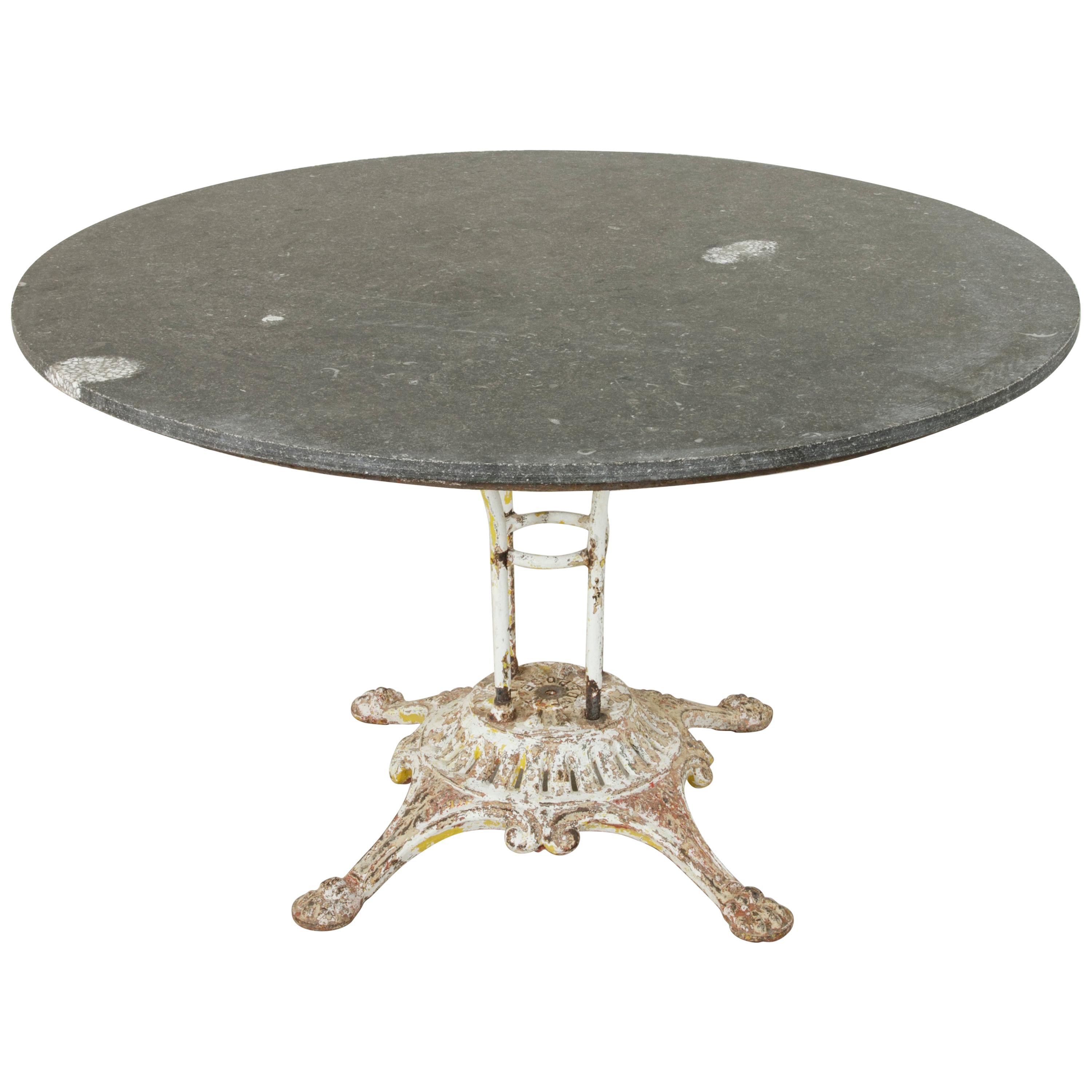 Large French Iron Garden Table with 49 Inch Diameter Blue Stone Top, circa 1900