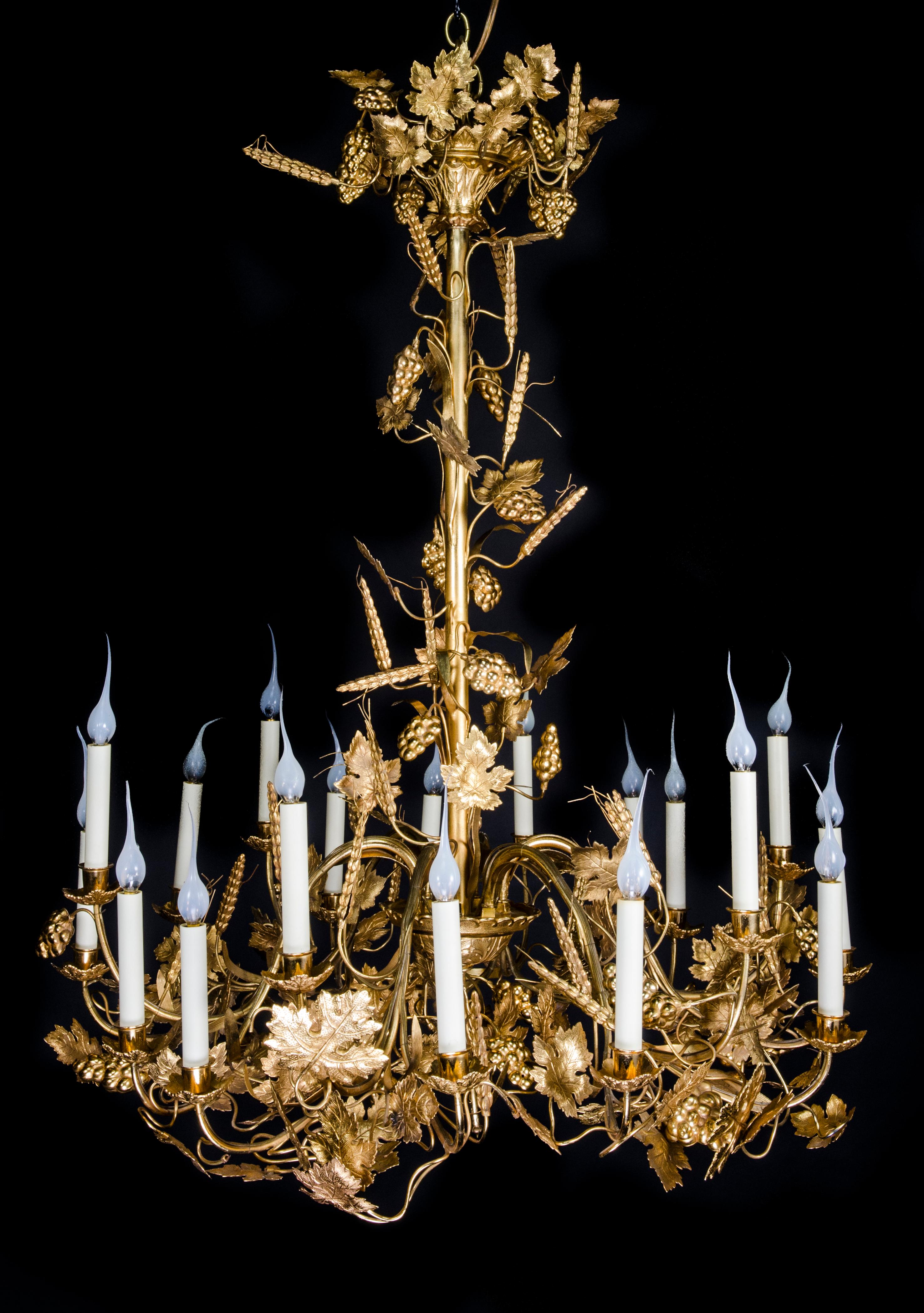 An elegant and finely cast Large French late 19th century Louis XVI style ormolu grape chandelier, beautifully blending grapes and grapevines with the classical symmetry of Louis XVI design. This impressive very large sixteen-light chandelier is