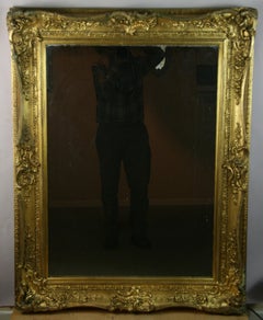 Gran espejo francés de madera dorada de finales del siglo XIX