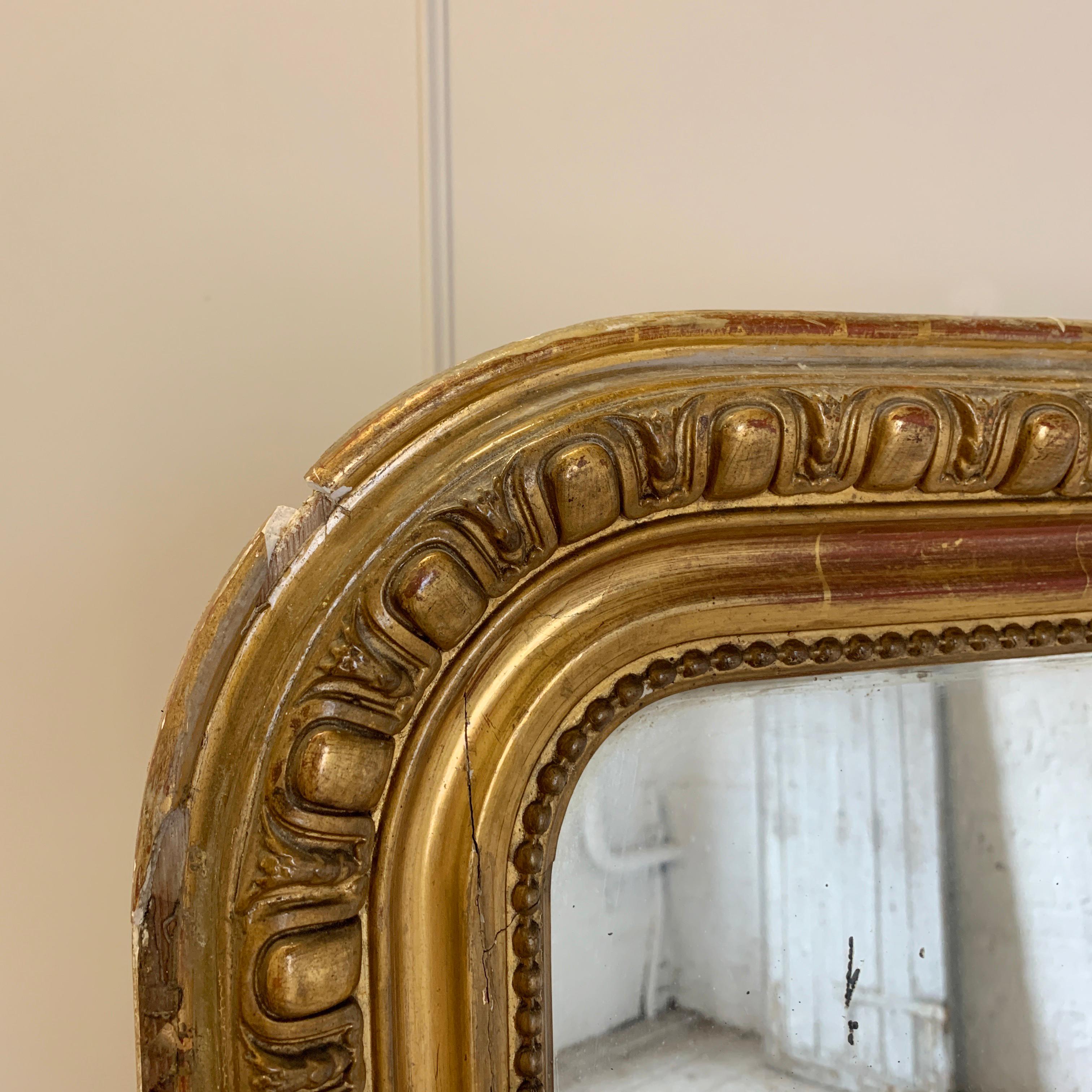 Beautiful, very large antique French Louis overmantle mirror. French, circa 1800s. Carved wooden frame with decorative gesso egg and dart pattern mouldings. Gilt finish. 120cm width, 144.5cm height, 7cm depth. This is a heavy mirror. Original wooden