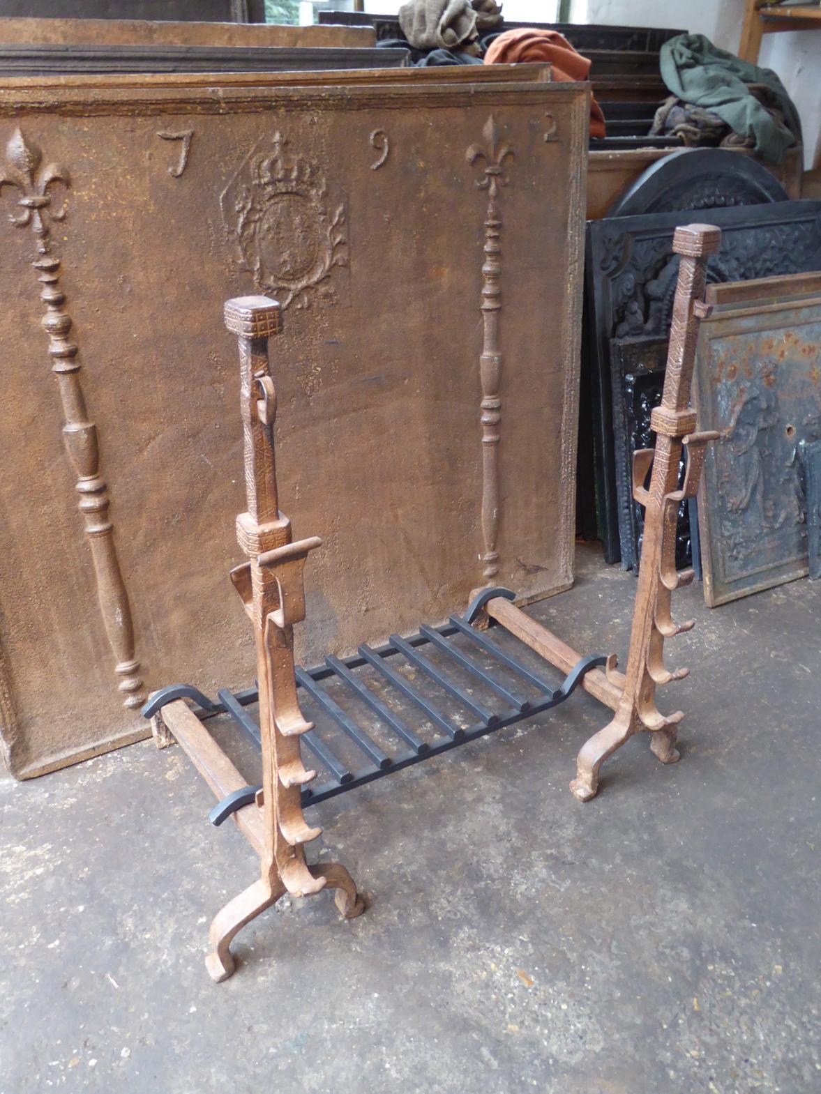 17th century French Louis XIII period fire grate. Made of beautifully forged wrought iron. The condition is good.

The width at the front is 81 cm (31.9 inches).




 