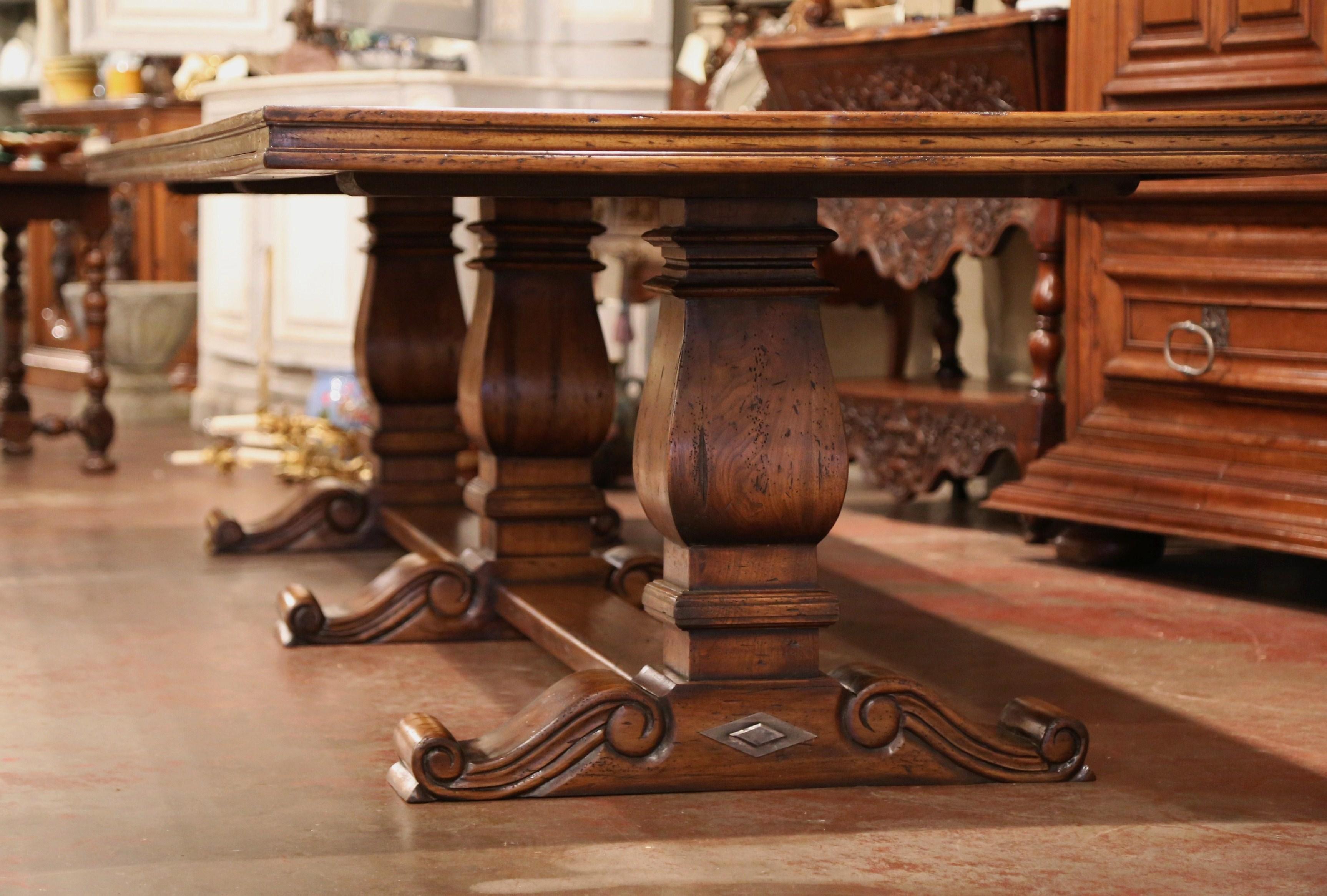 Large French Louis XIII Style Walnut Trestle Farm Table with Three Carved Legs In Excellent Condition In Dallas, TX