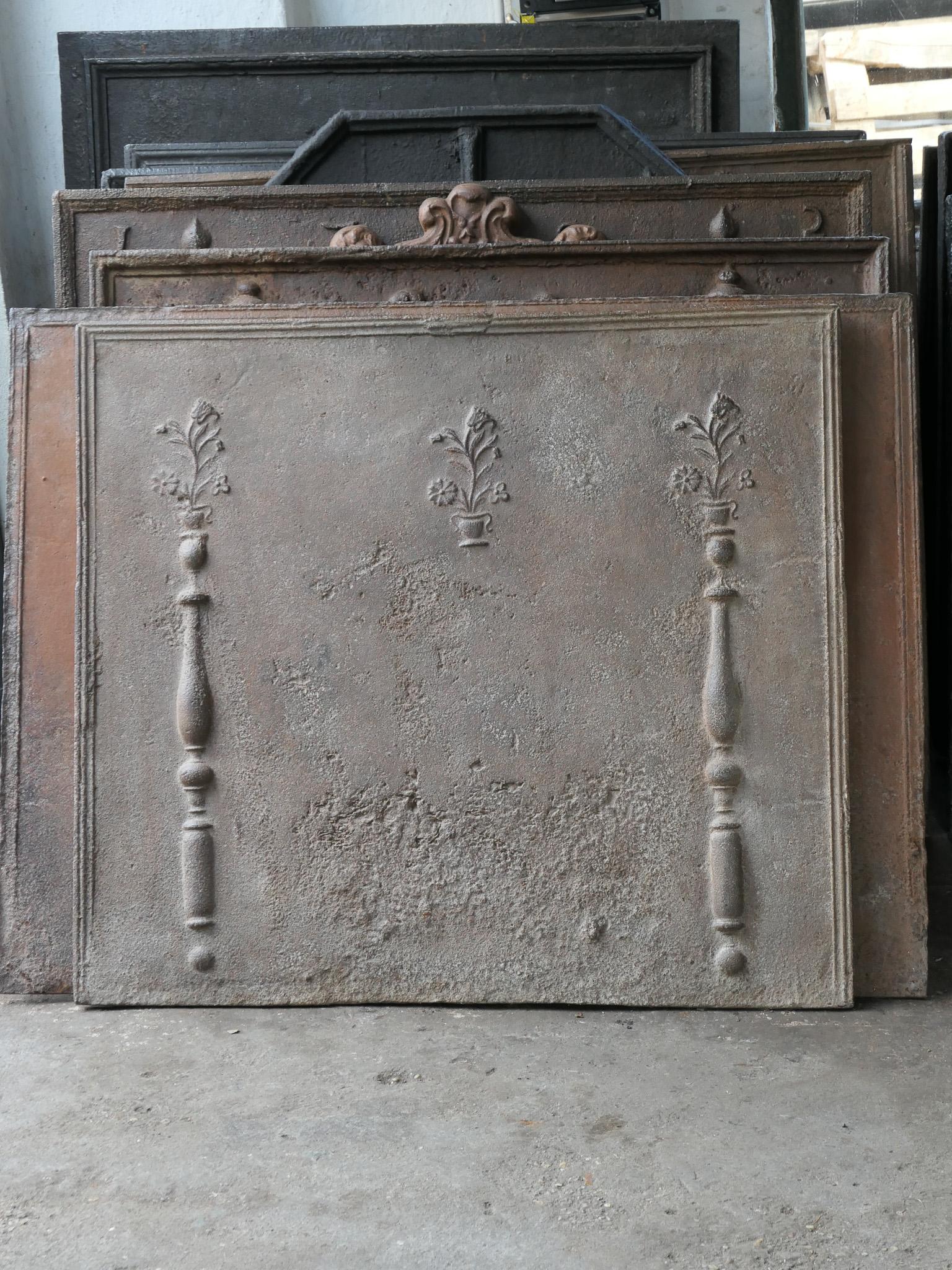 Beautiful 18th century French Louis XV fireback with flower baskets and two pillars. The pillars refer to the club of Hercules and Stand for strength and the unknown. Towards the end of the 18th century and the start of the Louis XV style, the