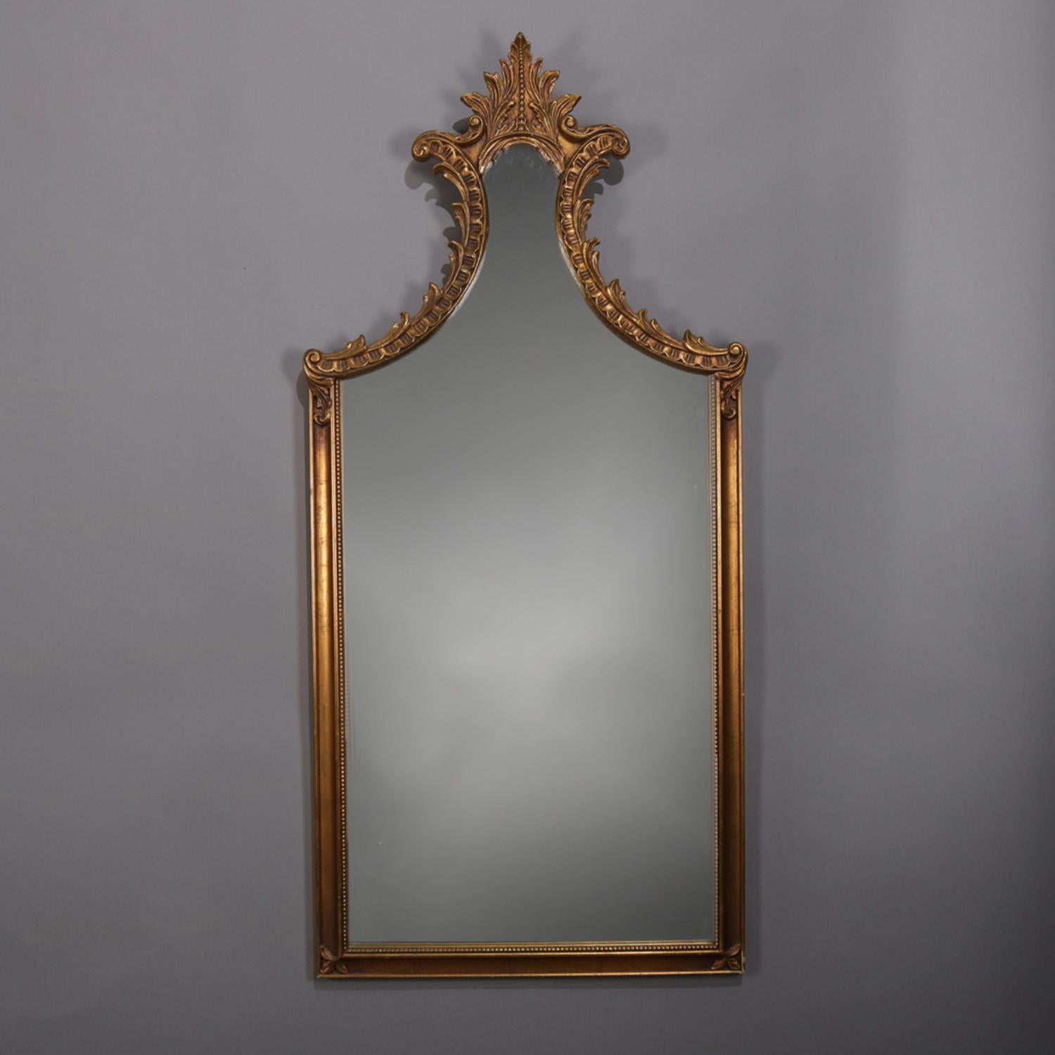 Large French Louis XV style wall mirror features shaped form with foliate and scroll decorated giltwood frame surmounted by an acanthus form crest, circa 1930

***DELIVERY NOTICE – Due to COVID-19 we are employing NO-CONTACT PRACTICES in the