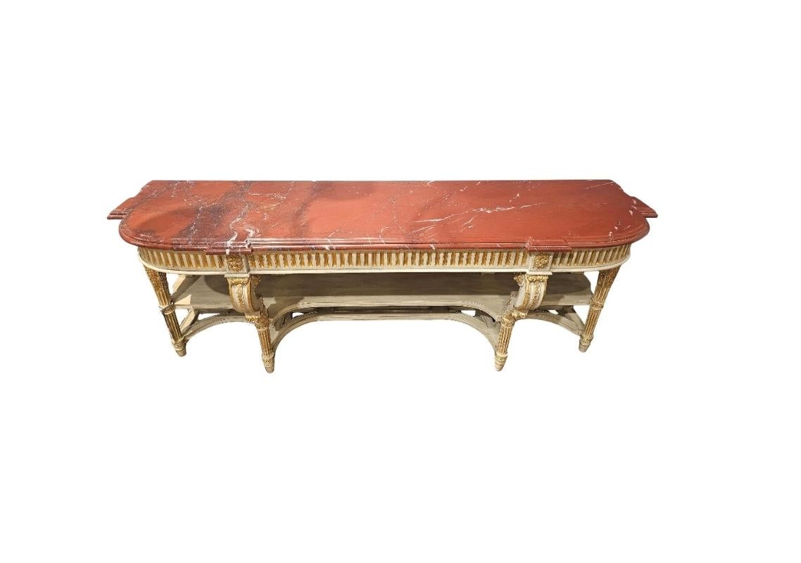 A large and most impressive vintage French Louis XVI style painted parcel gilt console table / server attributed to legendary Parisian design house Maison Jansen.

*Rare opportunity! Please note, at the time of writing this, we have a second