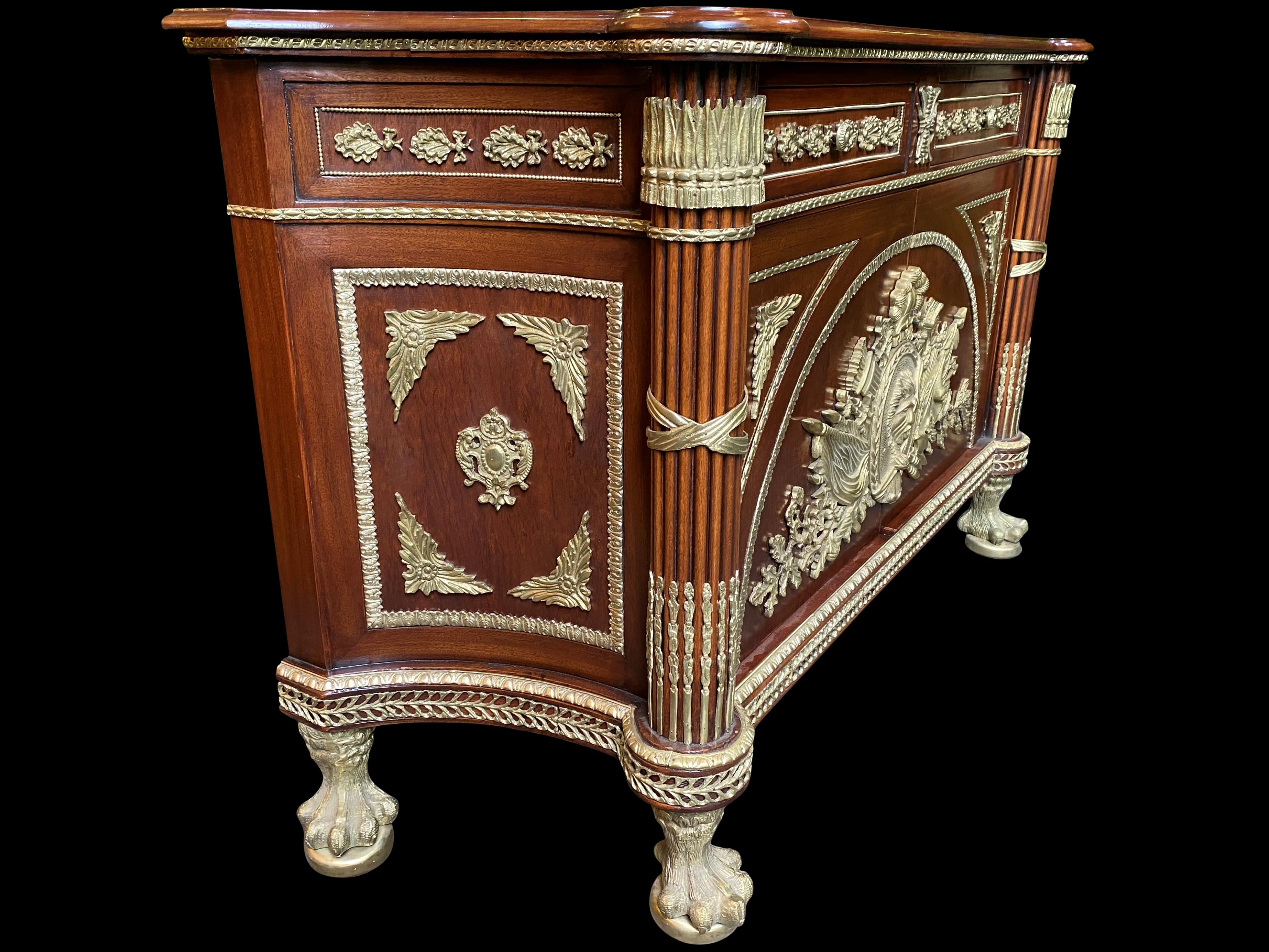 20th Century Large French Mahogany Empire Commode, Central Coats of Arms and Lion Paw Feet For Sale