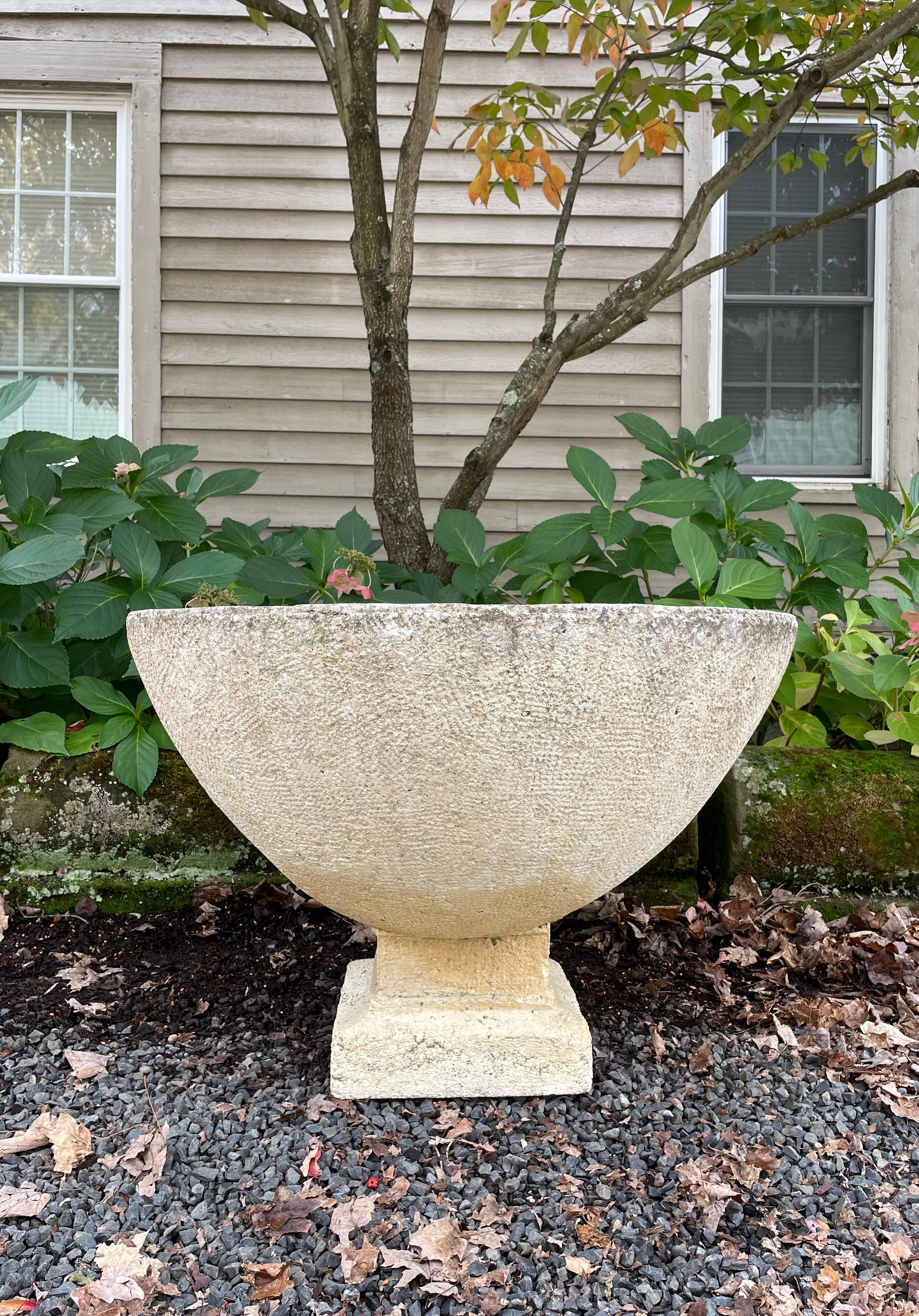 The form and patina on this mid-century French cast stone font are simply wonderful and its uses so varied. In two parts (the foot is separate from the bowl), it can be used as a font, planter, fountain, or fill it with sea shells and cover it with