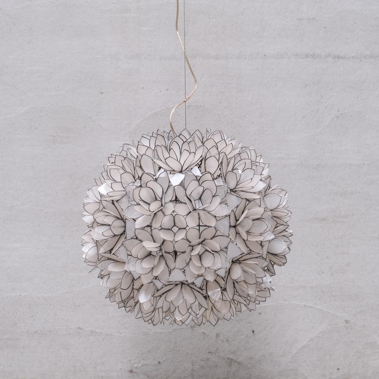 A large shell pendant light or chandelier.

France, c1960s.

Formed from Capiz shell intricately into a flower esque sphere.

Since re-wired and PAT tested.

PRICED AND SOLD INDIVIDUALLY. TWO AVAILABLE AT THE TIME OF LISTING.

Good vintage