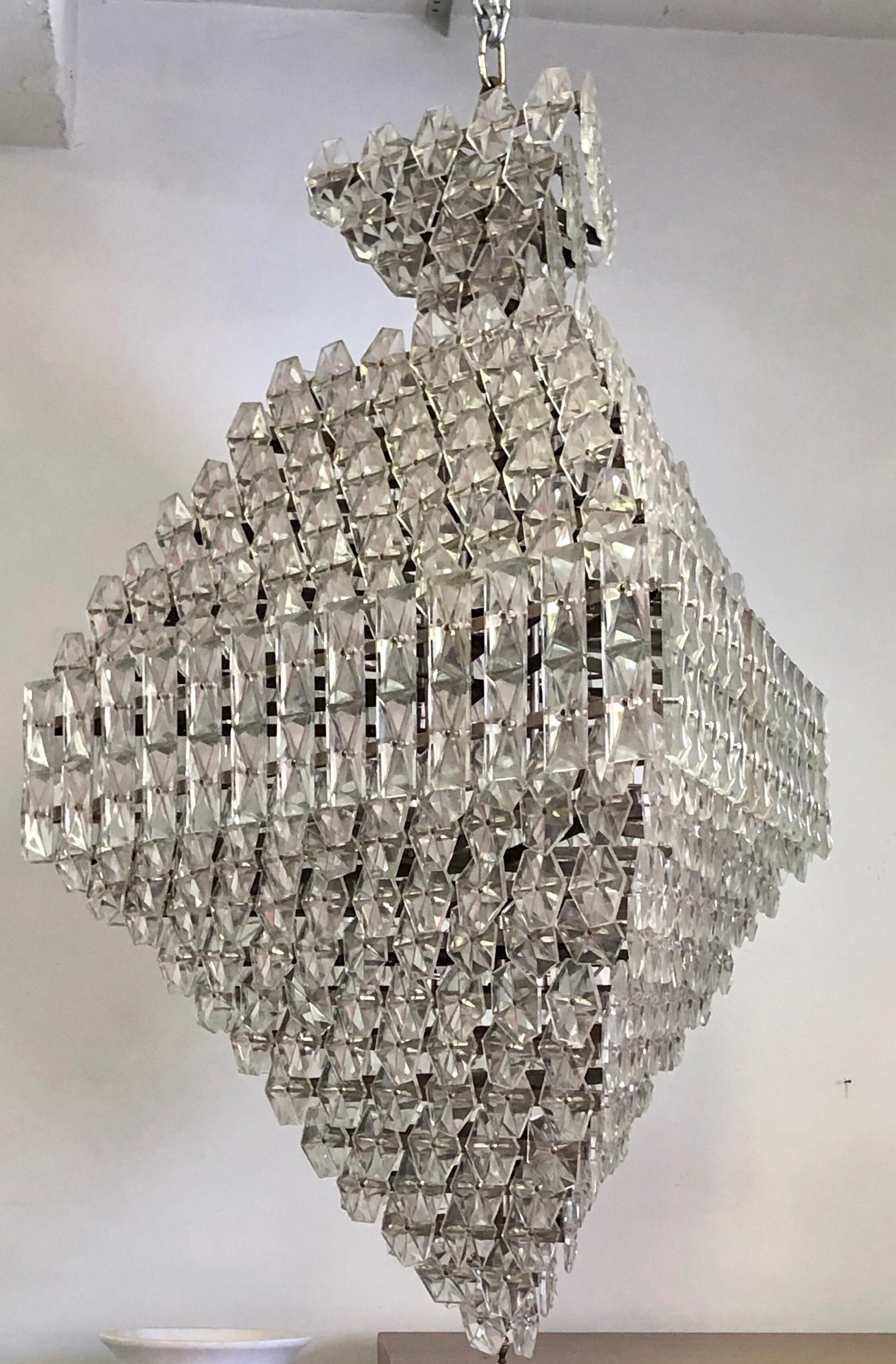 A rare, elegant and dramatic large Mid-Century Modern crystal chandelier in the form of a diamond or pyramid and attributed to Baccarat. The chandelier is composed in such a stunning way to transform any room to the highest level. It has been