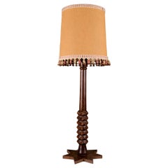 Large French mid-century turned and carved wood table lamp with star-base