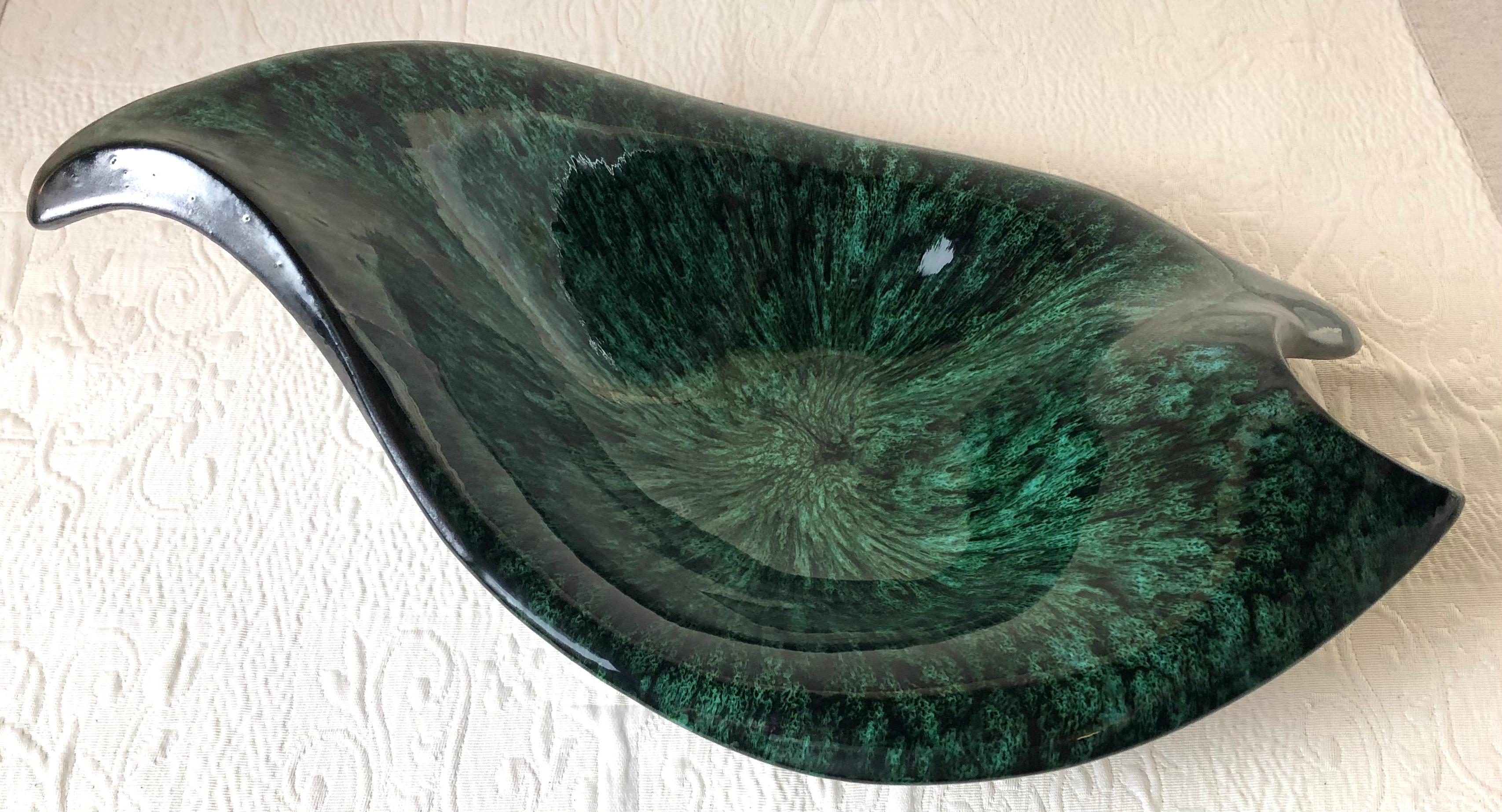 Stunning very large French mid-century black matte and glazed green ceramic bowl, signed.
This mid-century ceramic piece features magnificent colors of various shades of glazed green and a black matte finish on the base.

Would enhance any table or