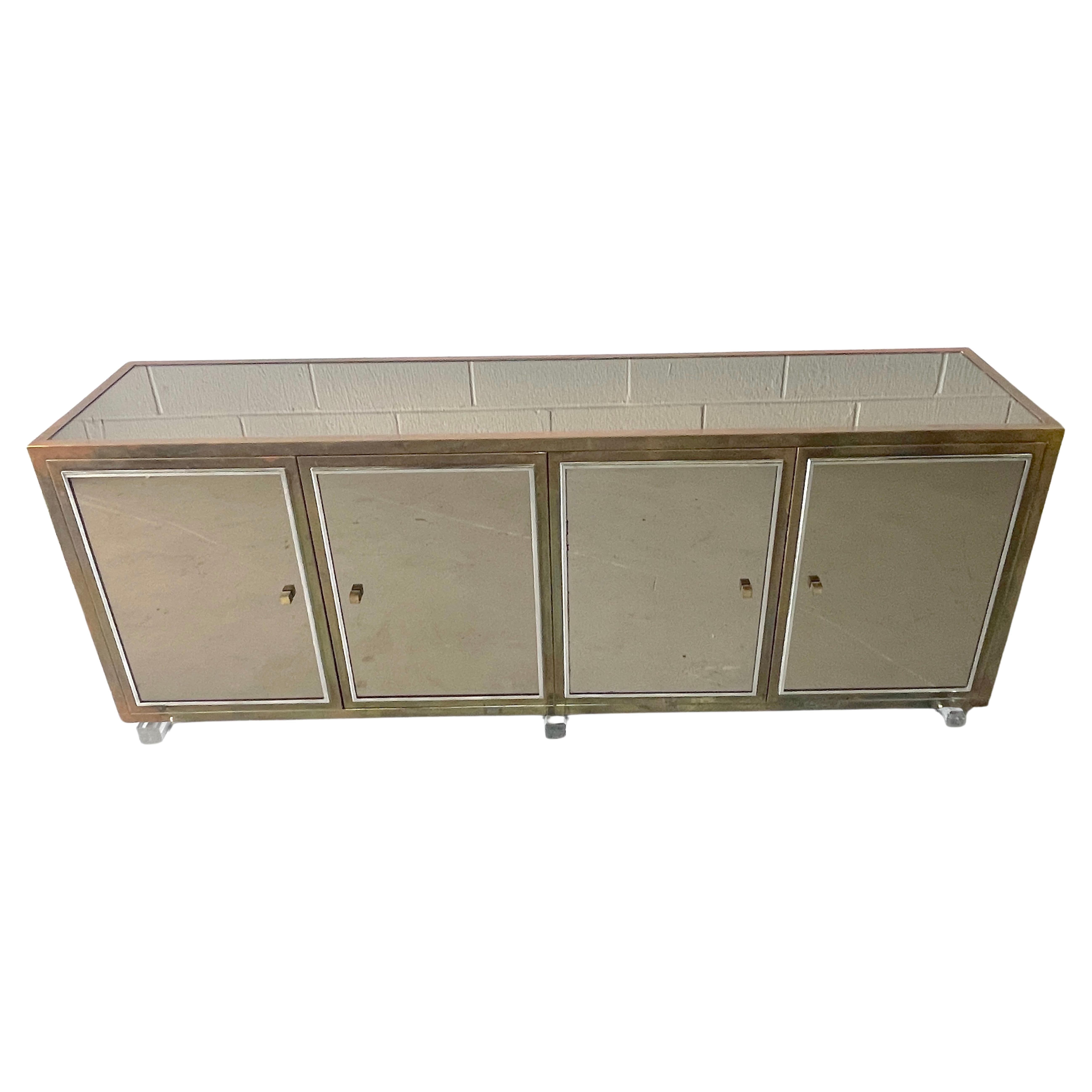Large French Modern Mirrored Credenza/Sideboard by Michel Pigneres 
France, circa 1970s

A stunning large French modern mirrored credenza/sideboard designed by the renowned Michel Pigneres, made circa 1970s in France. This piece stands as a