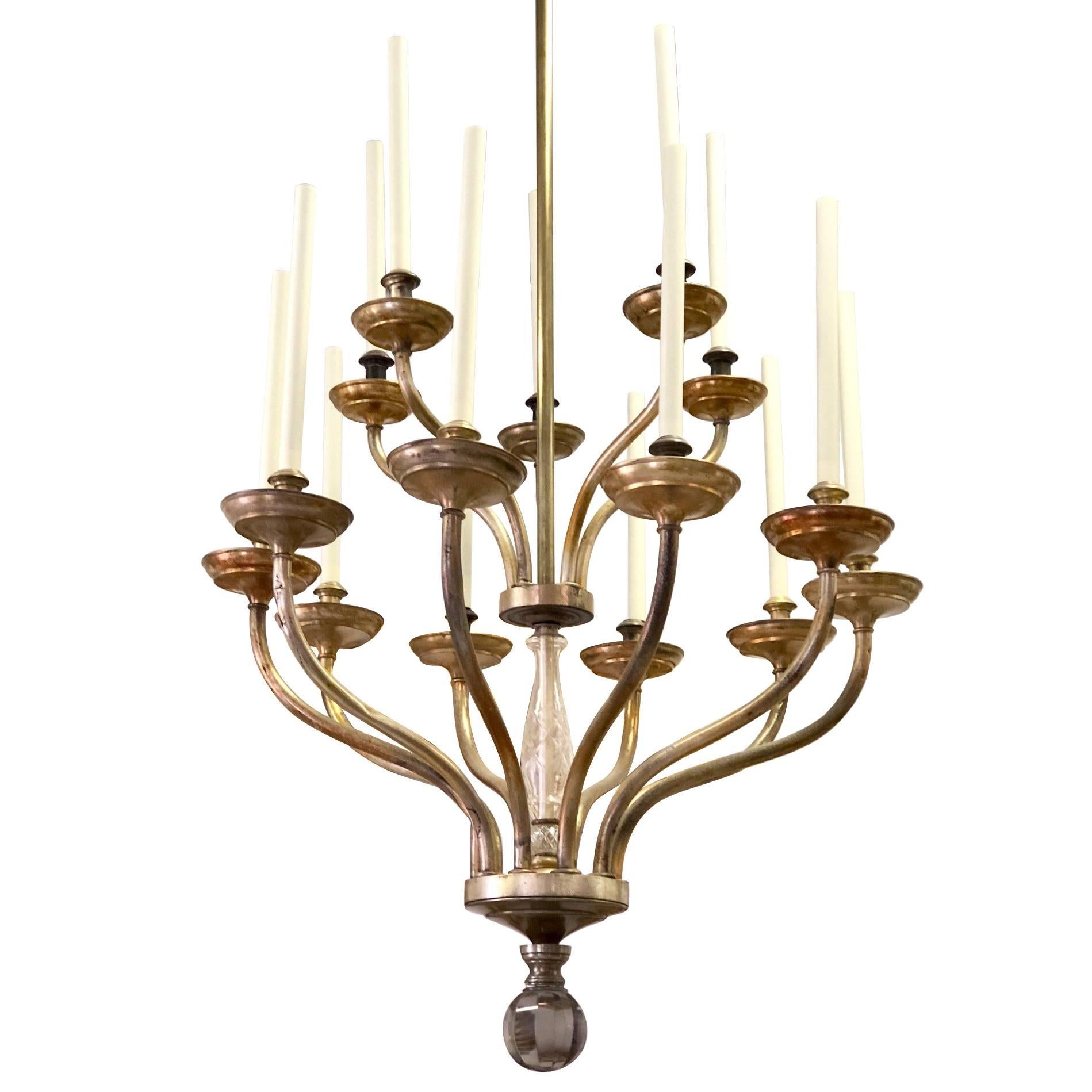 A large dramatic, yet sober double tier Italian Mid-Century Modern neoclassical chandelier attributed to Carlo Scarpa composed in a simple, pure pattern with 15 arms set with ten arms on the lower level and five arms on the upper level. The