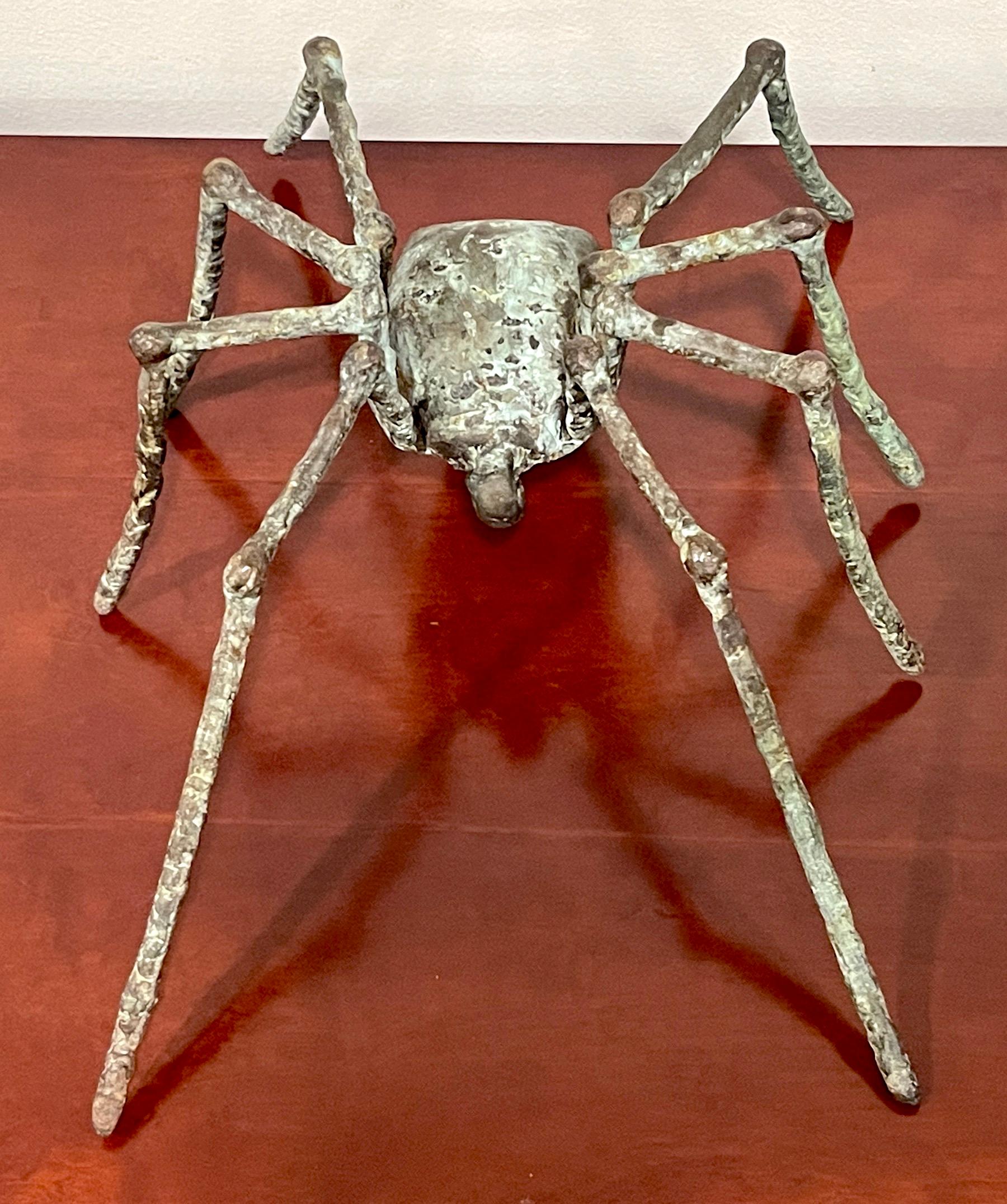 Large French Modern Patinated Bronze Sculpture of a Spider in Stride
France, Circa 1990s

A substantial, heavy,  well executed cast and patinated bronze model of a spider in motion. Sculpted with some of the eight legs off the ground. This work
