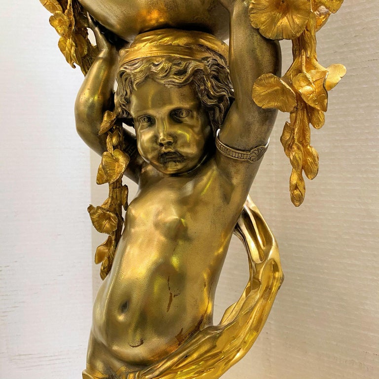 Large French Neoclassical Bronze Clock Depicting Standing Cupid For Sale 1