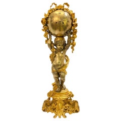 Large French Neoclassical Bronze Clock Depicting Standing Cupid