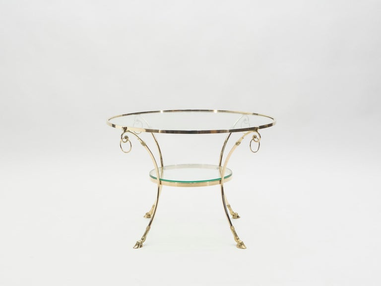 This gueridon table from the 1970s is a beautiful example of French neoclassical design by Maison Charles. But, with its sleek, paired-down look, it also feels inspired by Art Deco design. A slim brass structure is dramatically curved to form the