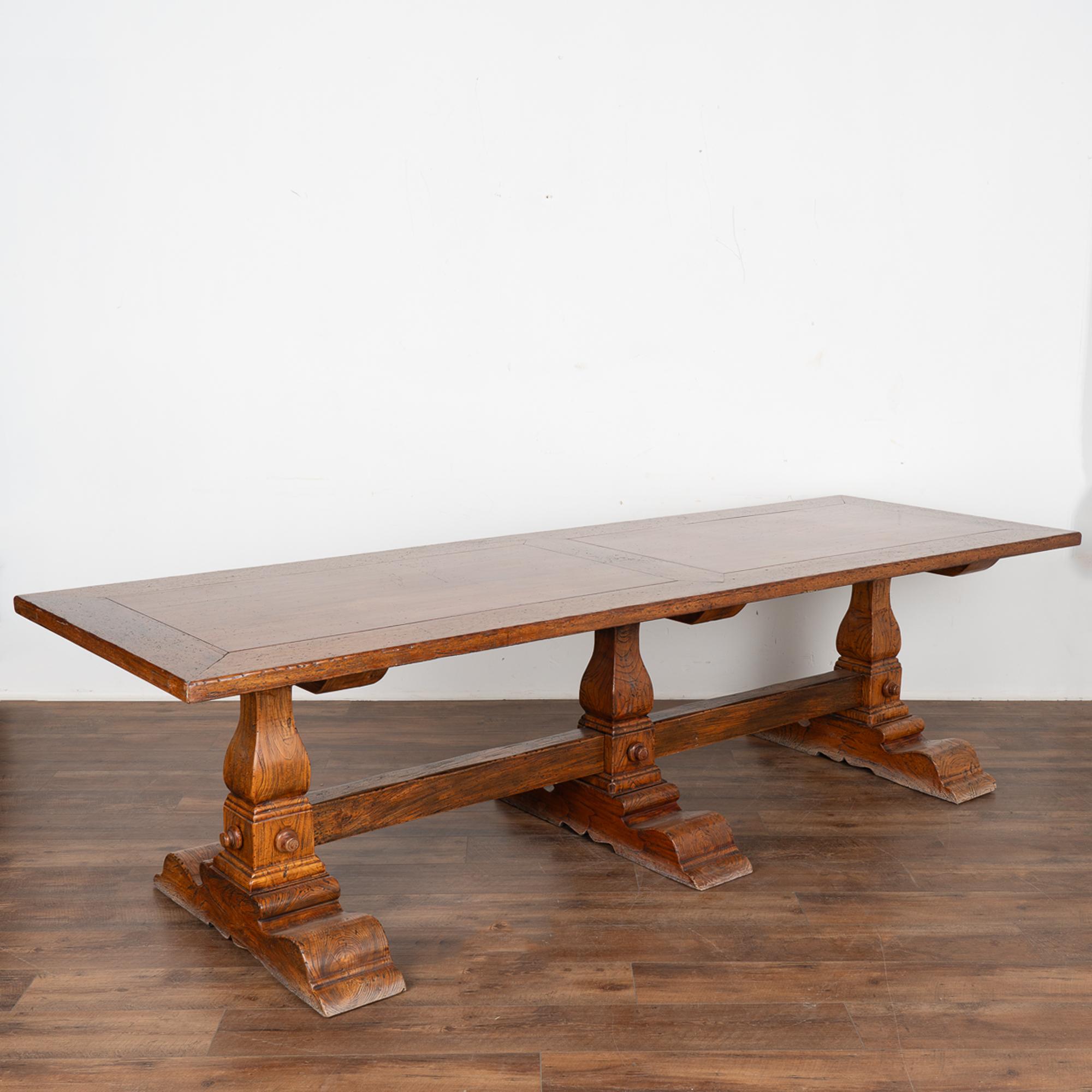 Impressive in size at just under 9' long, this library or refectory table will make a dramatic dining table and gathering place in today's modern home.
The large oak table reveals years of use as seen by typical scratches, nicks, separation of wood