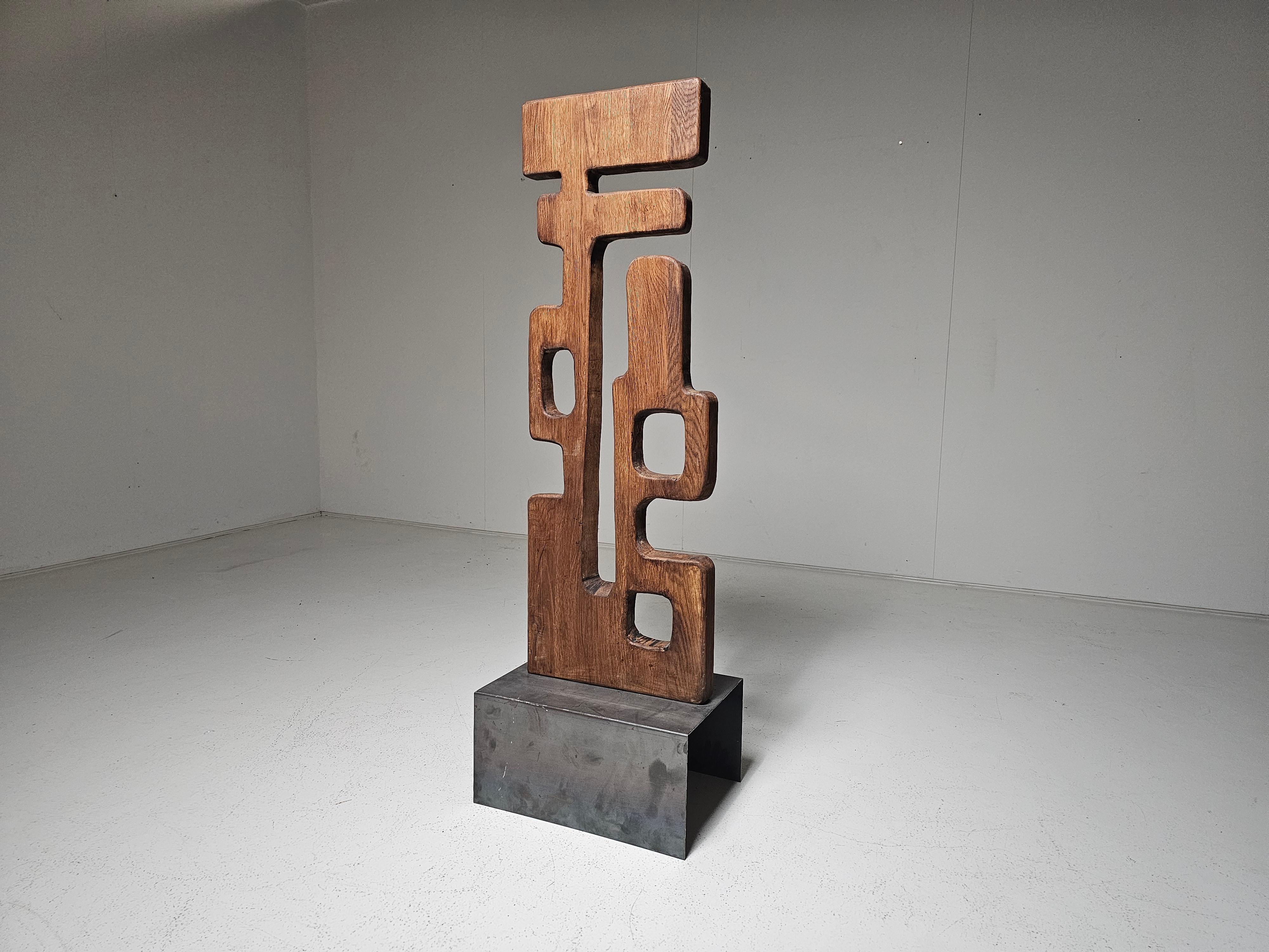 Striking, large-scale abstract sculpture. Carved from solid oak in the 1950s. It embodies the spirit of post-war modernism. Its bold, organic form and tactile surface speak to a time when artists returned to nature and craftsmanship, embracing the