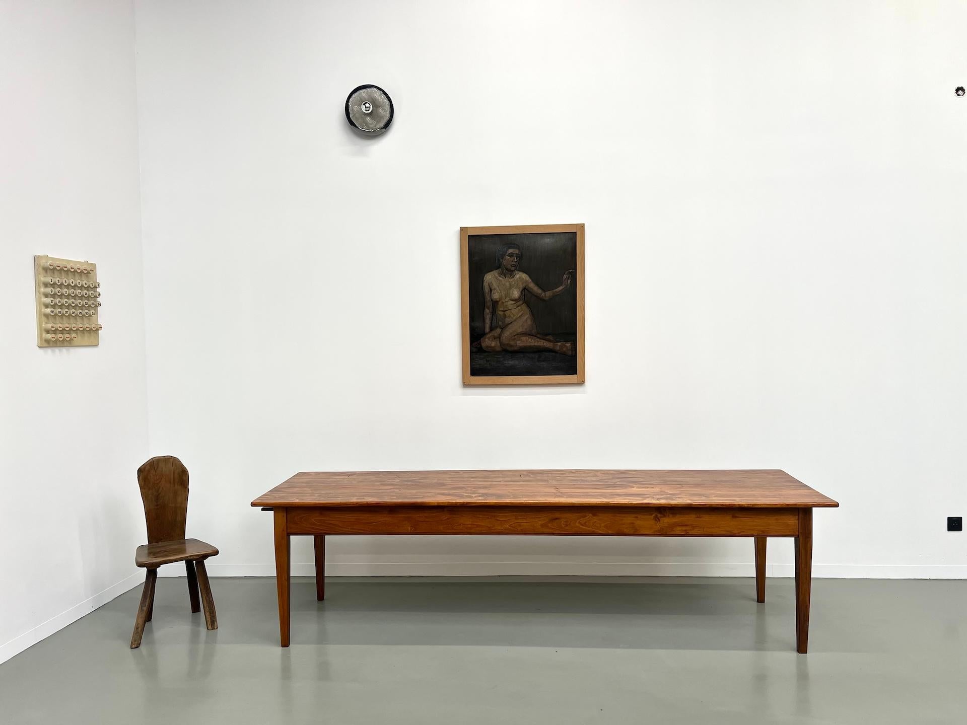 This farm table is superb and shows period French artisanal know-how. With its impeccable finishes, its quality fittings and its unique patina, this table will immediately bring character wherever it is installed. Its great length makes it the ideal