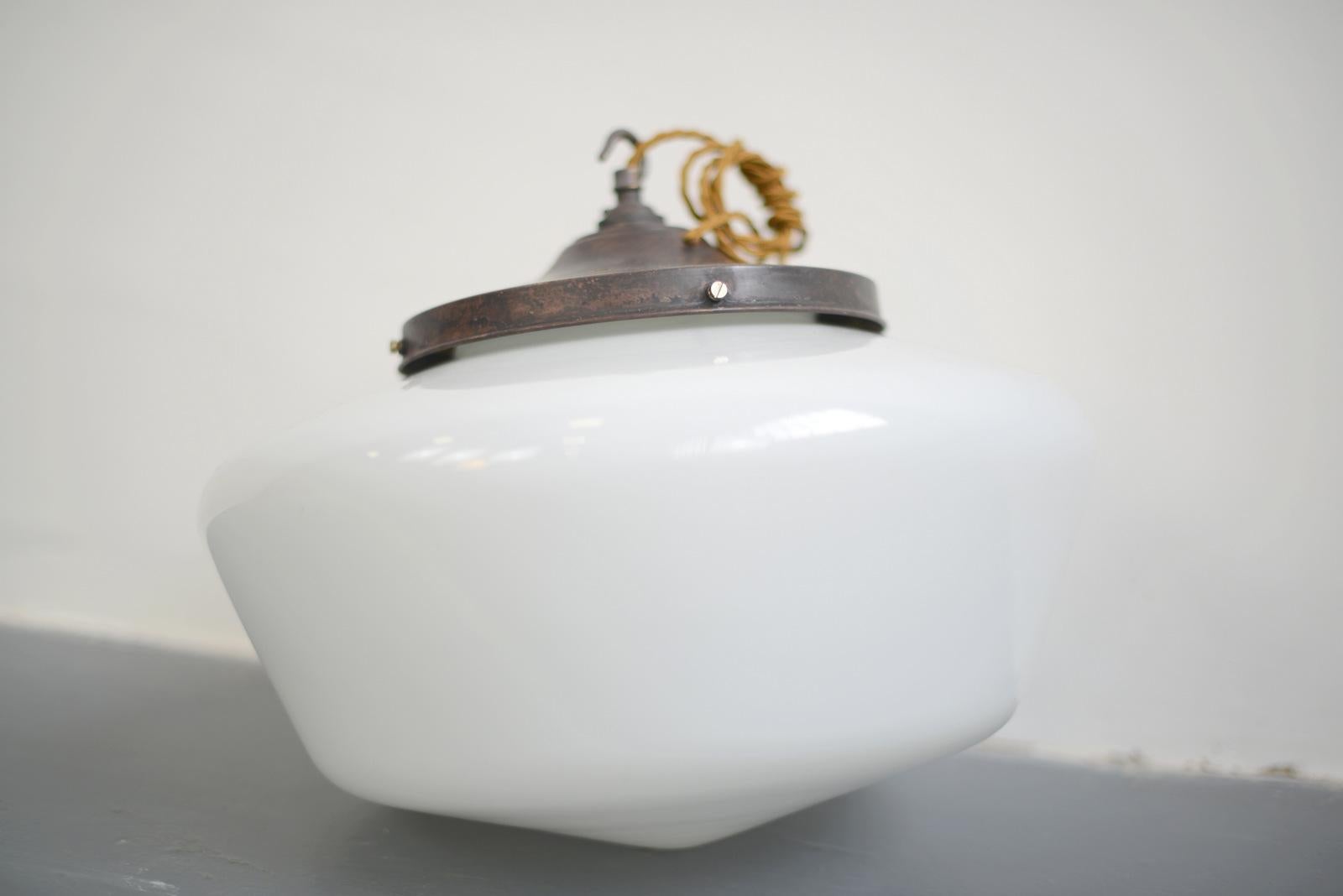 Large French opaline pendant light, circa 1930s

- Copper gallery
- White opaline glass
- Made by Mazda
Takes B22 fitting bulbs
- French, 1930s
- 40cm wide x 32cm tall

Condition report

Fully re wired with modern electrical components.
 